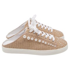 Mules Goldie di Stuart Weitzman in rafia beige