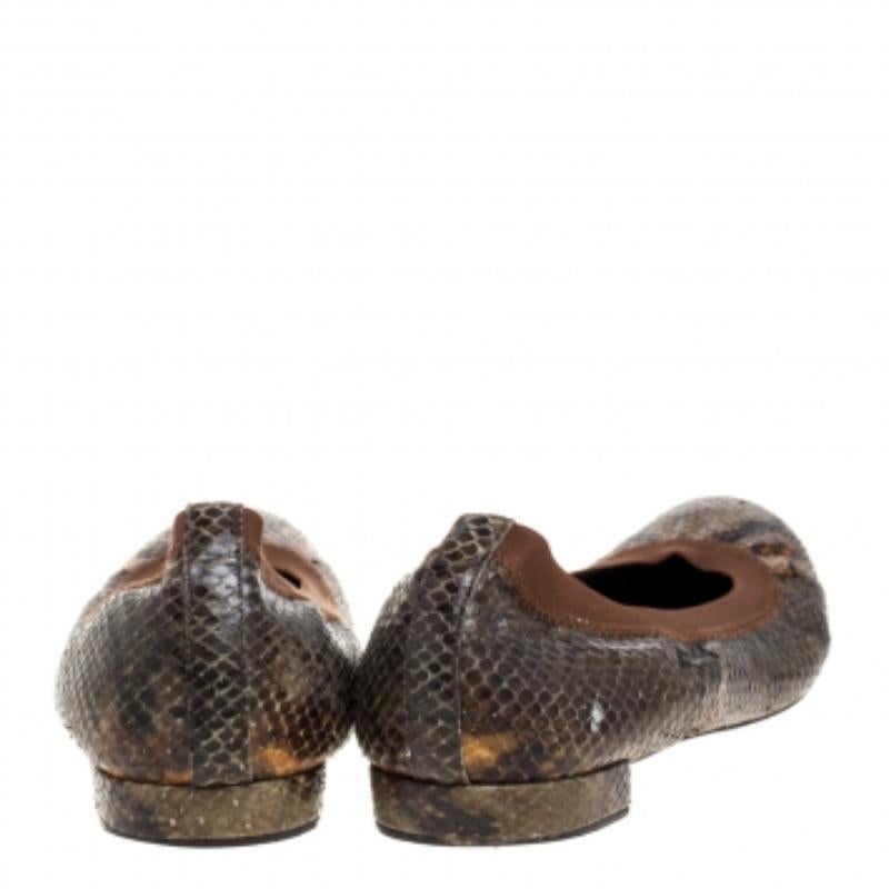 Chic and simple, these ballet flats from Stuart Weitzman and perfect for a host of occasions. They have been crafted from python-embossed leather, they are styled with round toes, suede insoles, and durable soles.