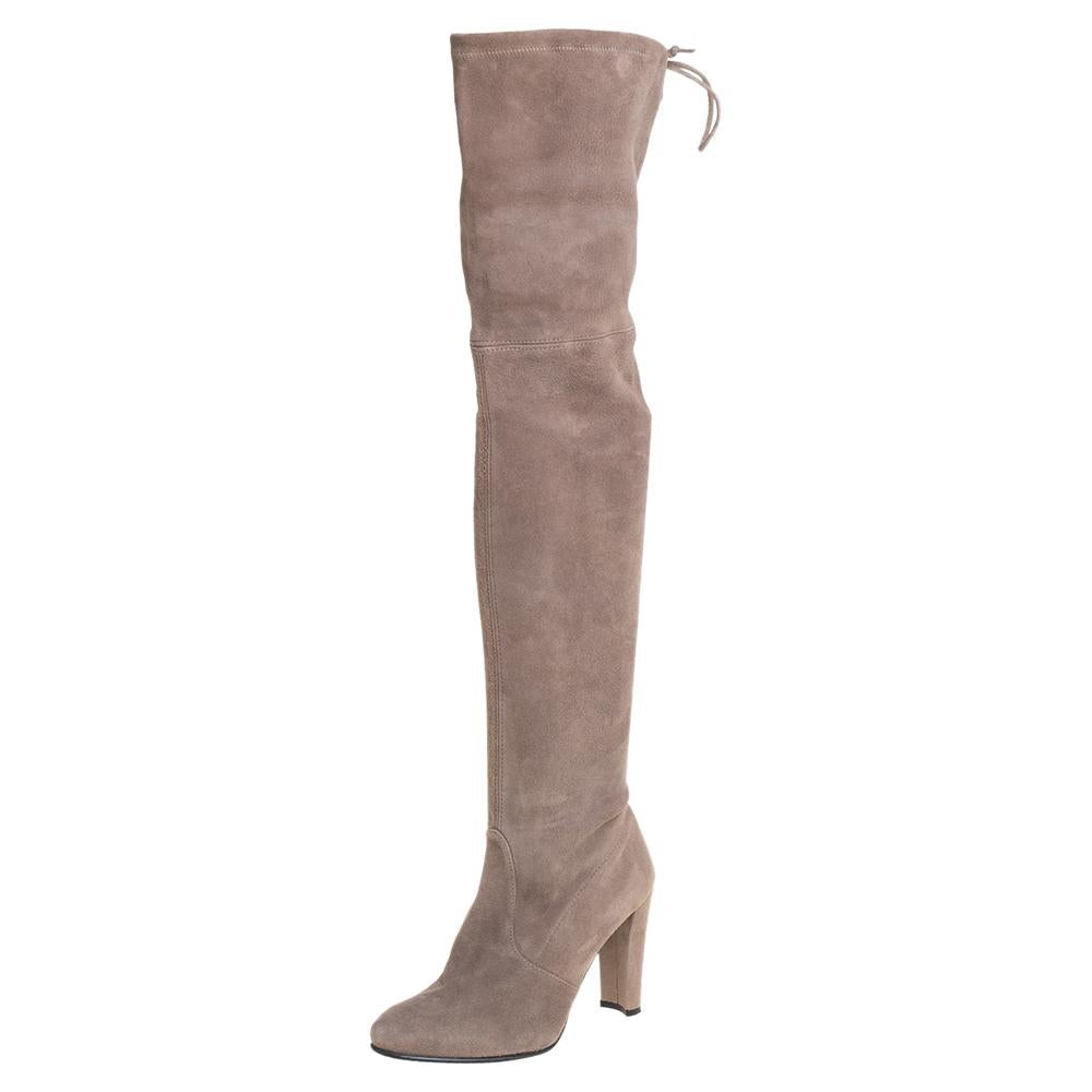 If you're looking to add a pair of thigh-high boots to your collection, it should be from Stuart Weitzman! These grey boots are crafted from suede into a chic silhouette. They flaunt covered toes, comfortable leather-lined insoles, self tie-up
