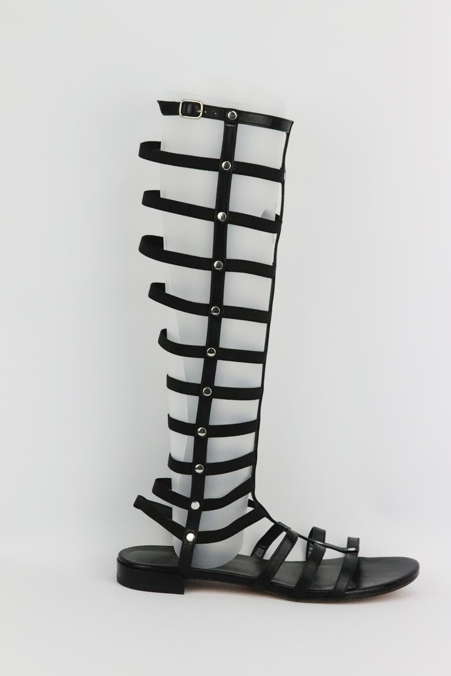 Stuart Weitzman leather knee high sandals. Made from black leather with silver-tone studded detail. Black. Zip fastening at side. Does not come with box and dustbag. Size: EU 38 (UK 5, US 8). Shaft: 14.2 in. Insole: 9.8 in. Heel: 0.8 in
