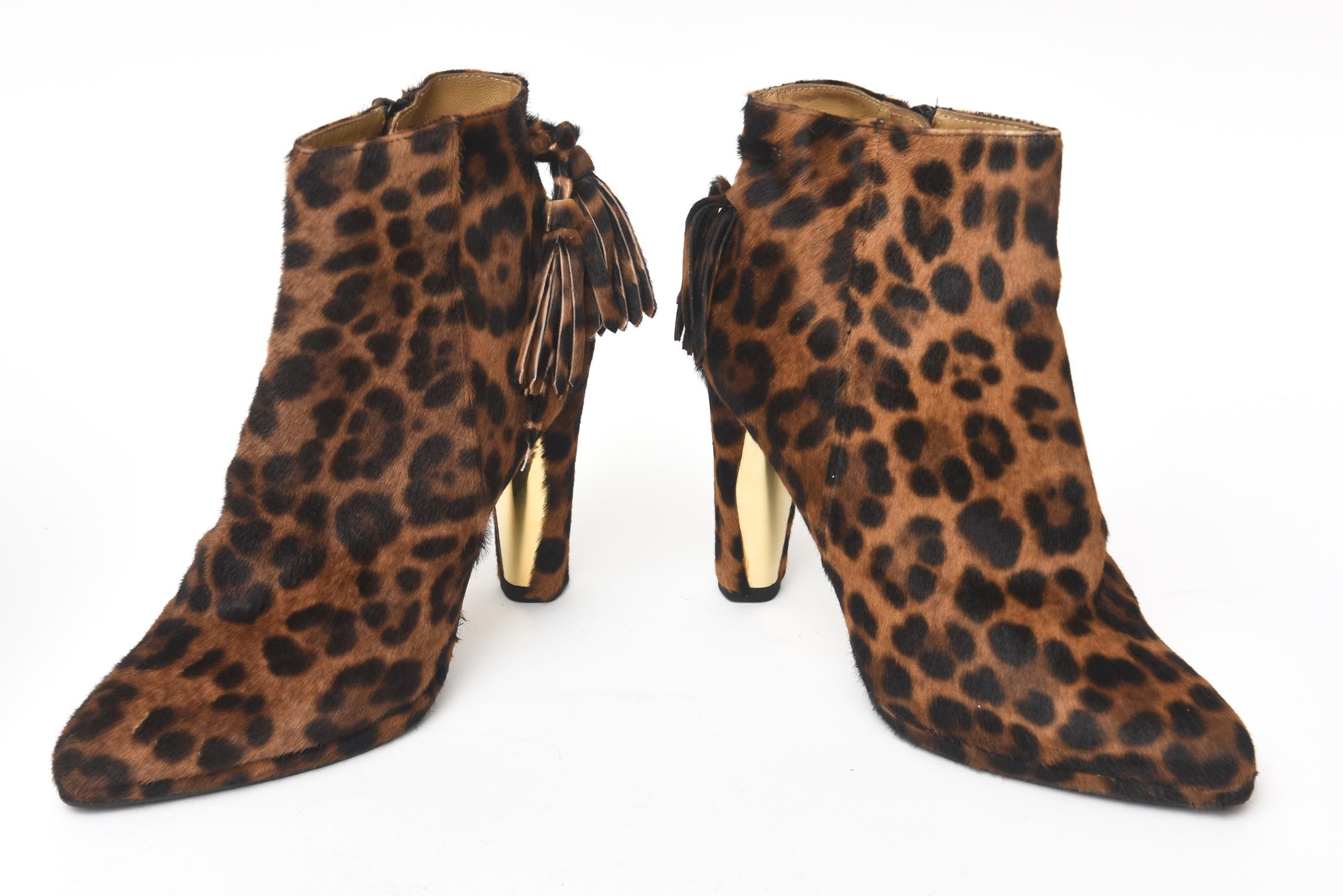 This oh so chic never worn leopard pony hair ankle boots have all the richness with their tasseled back and side zipper. Their heal is gold embellished. They are a size 6 and never worn. Their retail was over $650.00 They have their original box and