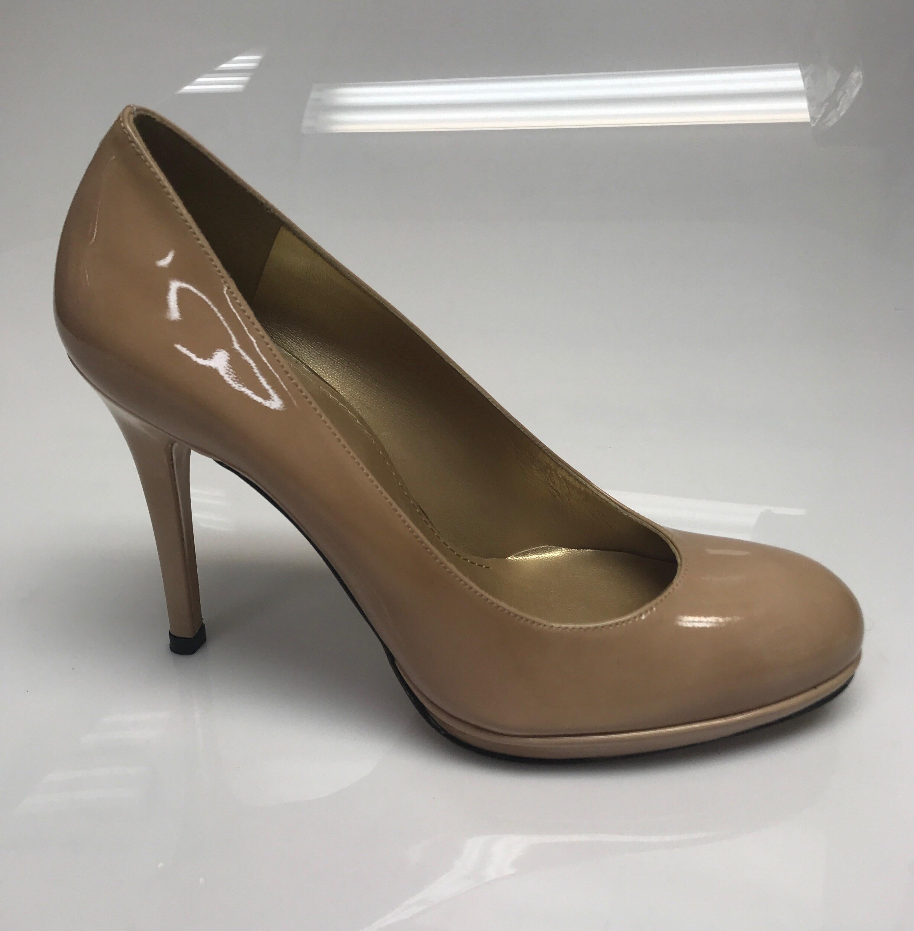Stuart Weitzman Nude Patent Leather Heel-8. These beautiful Stuart Weitzman heels are in excellent condition, with exception to the bottom showing sign of use, as shown in pictures. These shoes are made of a nude patent leather. They are a rounded
