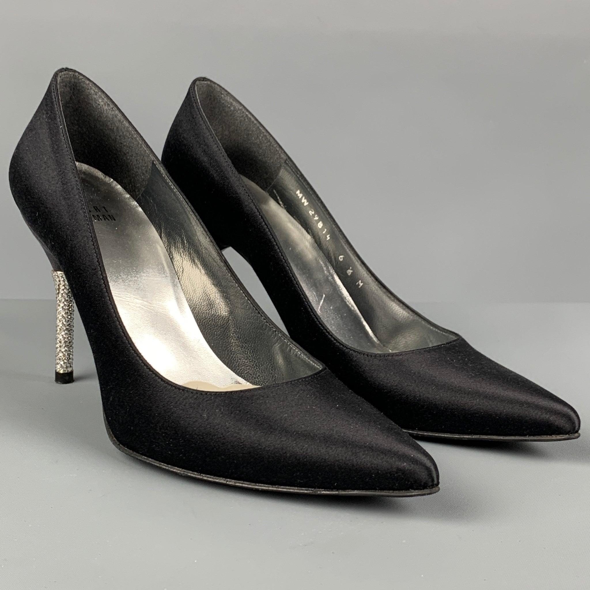 STUART WEITZMAN pumps comes in a black & silver silk featuring a rhinestone heel and a pointed toe. Made in Spainches 
Very Good
Pre-Owned Condition. 

Marked:   MW 29814 6.5M 

Measurements: 
  Heel: 3 inches 
  
  
 
Reference: 116940
Category: