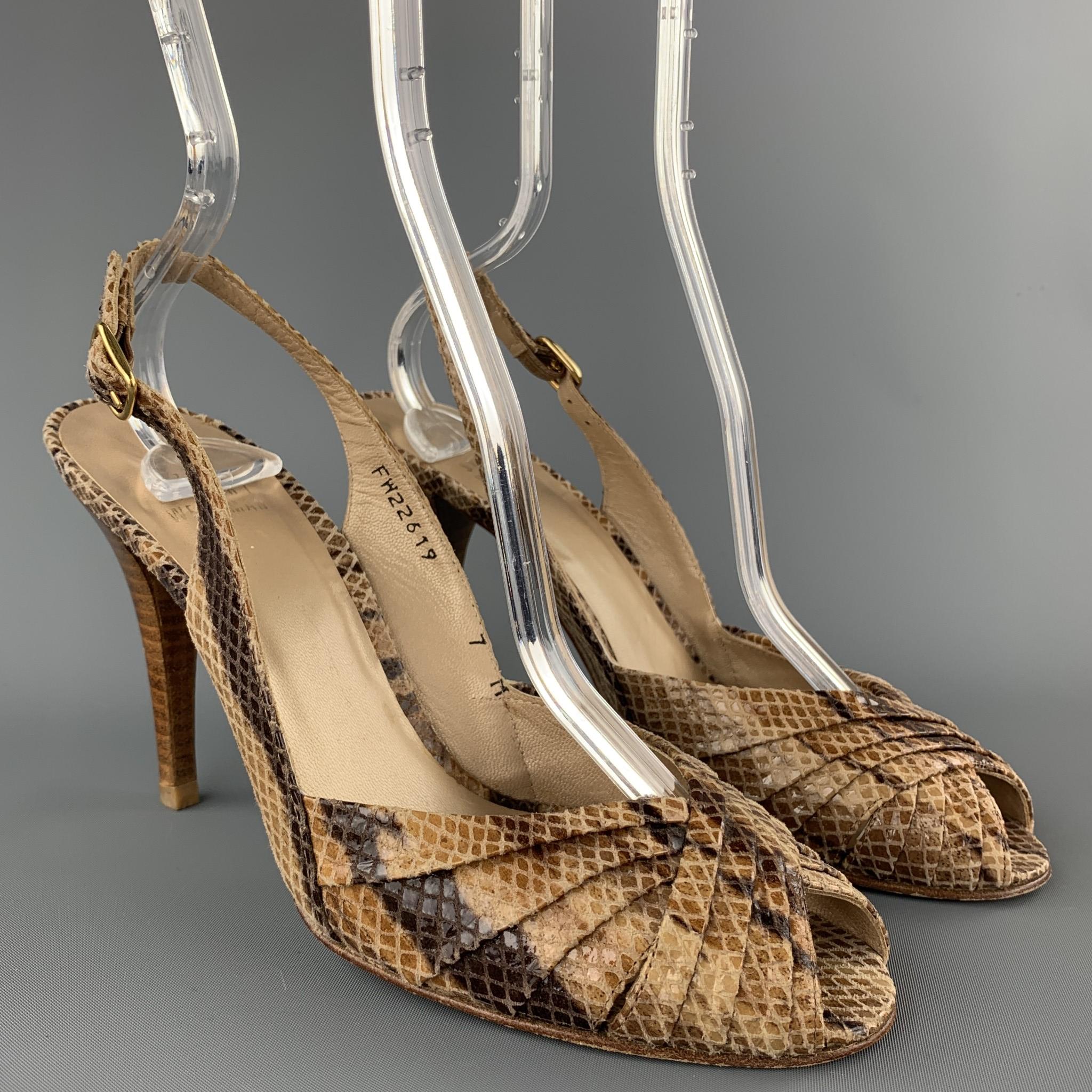 STUART WEITZMAN sandals comes in a beige snake skin print featuring a stacked heel and a slingback strap closure. As-Is.

Good Pre-Owned Condition.
Marked: 7 M

Measurements:

Length: 7.5 in. 
Width: 3 in. 
Heel: 4 in.