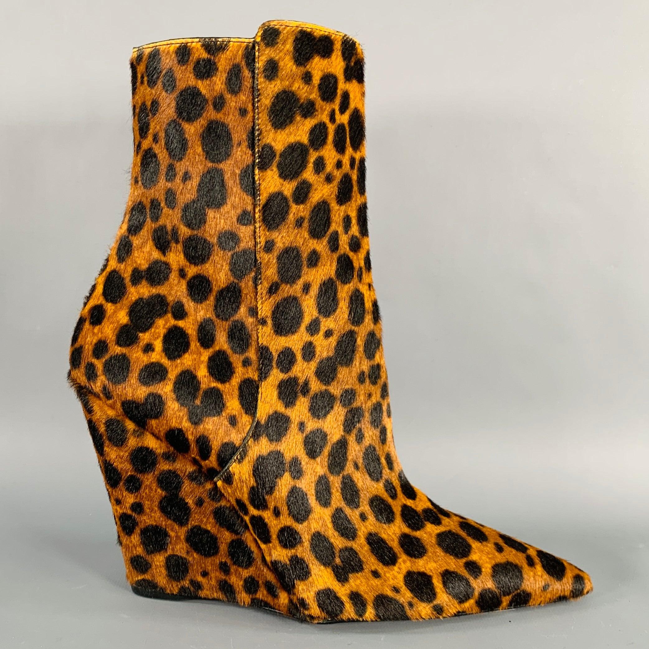STUART WEITZMAN boots
in a brown and black animal print calf hair featuring a wedge style, pointed toe, and side zipper closure. Made in Spainches Excellent Pre-Owned Condition. 

Marked:   SD241 PS23 SU 

Measurements: 
  Length: 9 inches Width: 3