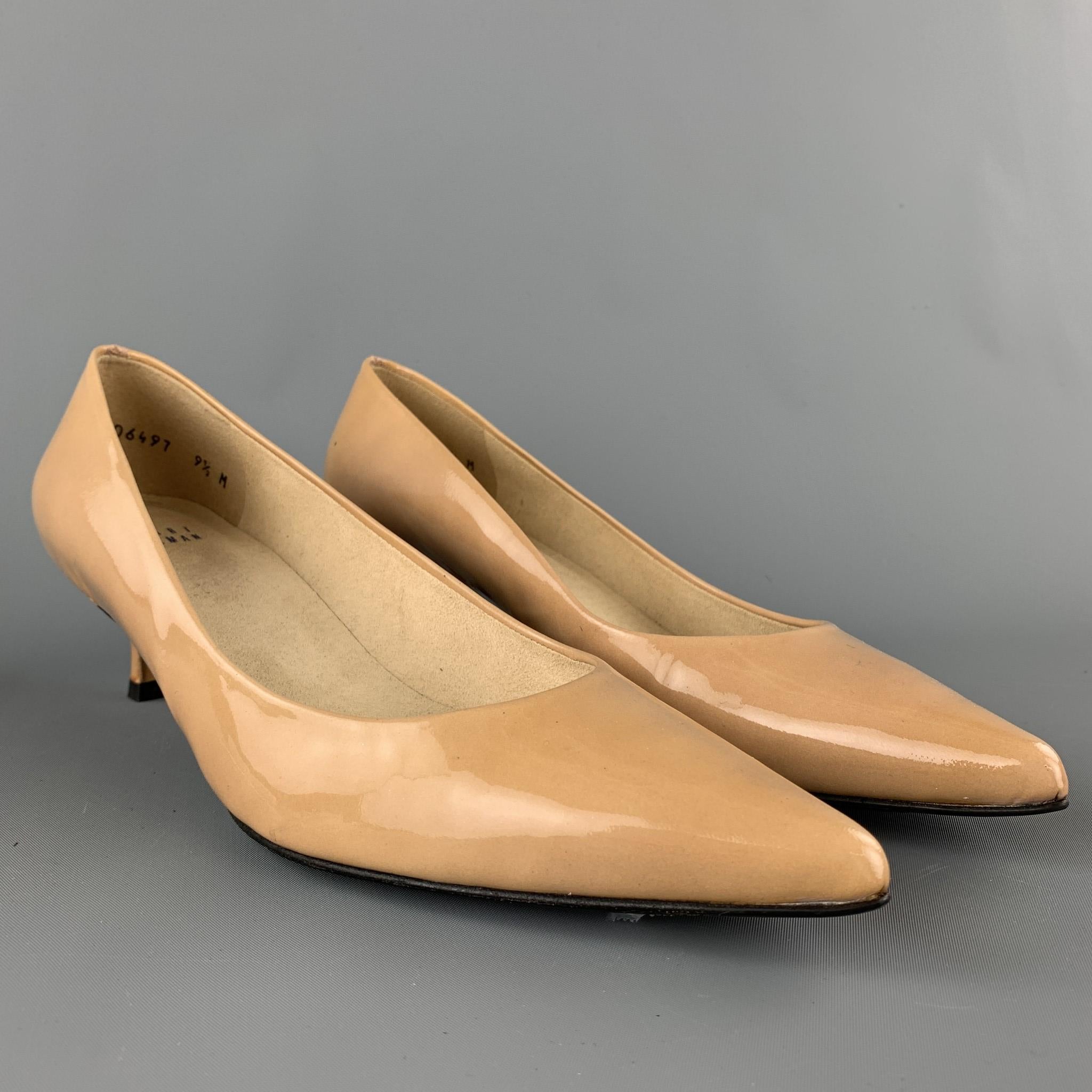 STUART WEITZMAN pumps comes in a beige patent leather featuring a pointed toe and a kitten heel. Comes with box.

Very Good Pre-Owned Condition.
Marked: 9.5 M

Measurements:

Heel: 2 in. 

SKU: 90286
Category: Pumps

More Details
Brand: STUART