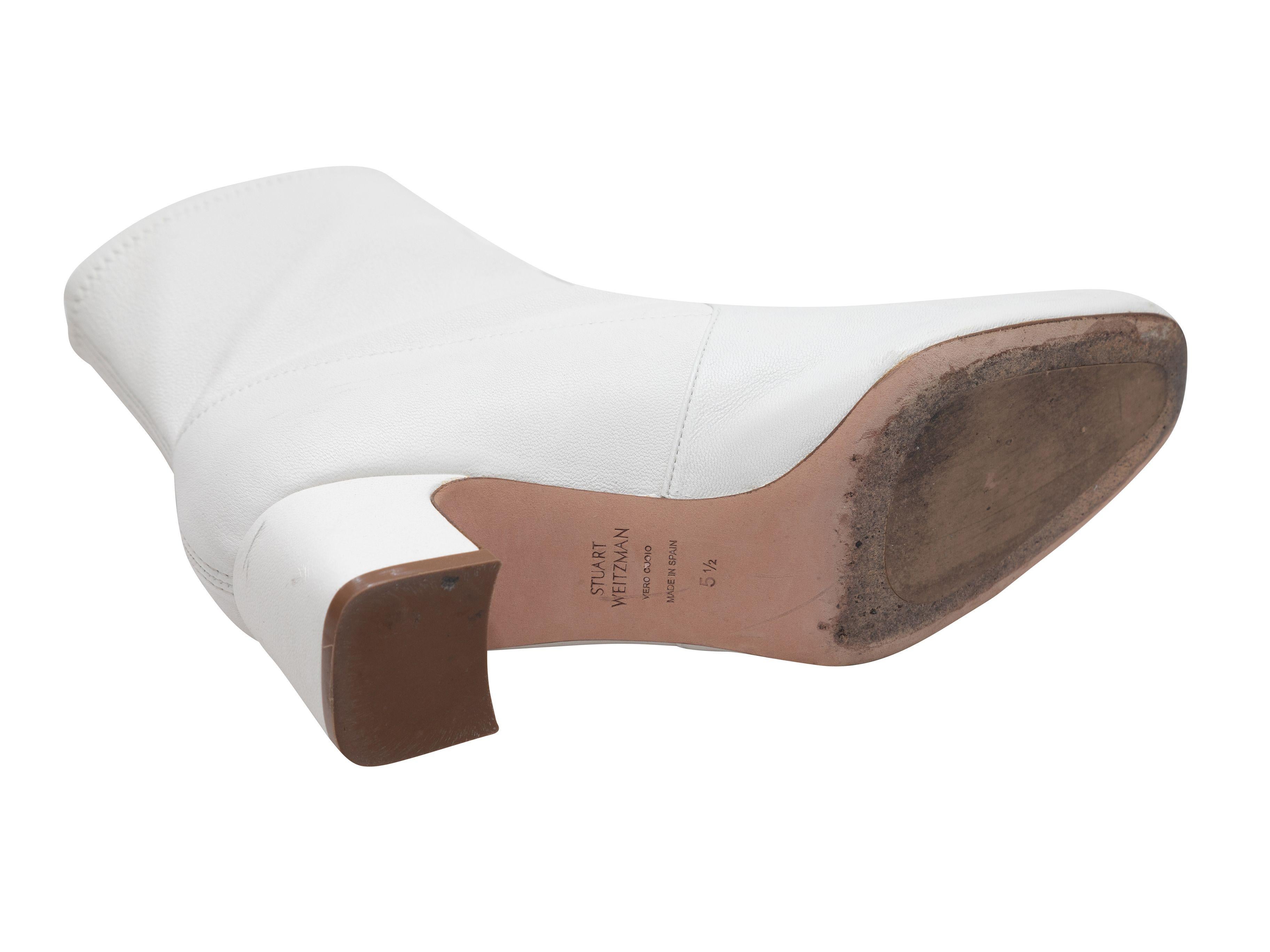 Product Details: White leather sock boots by Stuart Weitzman. Pull-on style. Block heels. 2.25