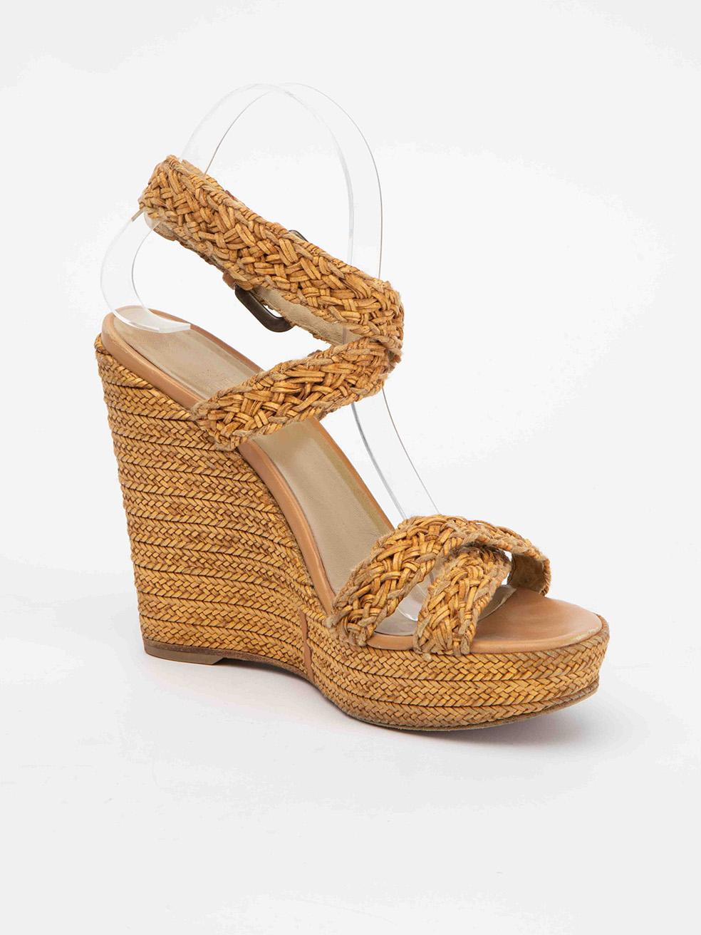 CONDITION is Very good. Minimal wear to shoes is evident. Light wear to heels and insoles as well as pulling to suede lining of straps on this used Stuart Weitzman designer resale item. 
 
 Details
  Brown
 Cloth textile
 Weaved sandals
 Open toe
