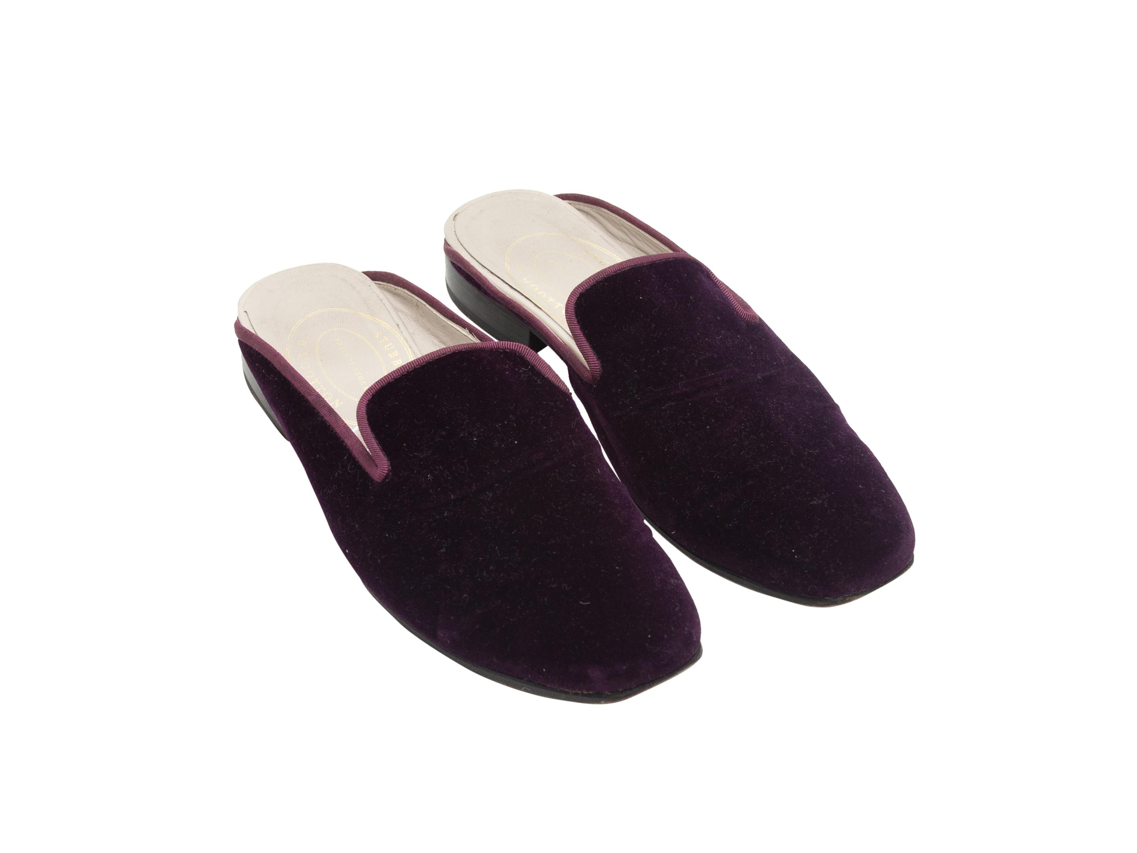 Product details: Eggplant purple velvet mules by Stubbs & Wootton. Grosgrain trim throughout. Stacked heels. 1