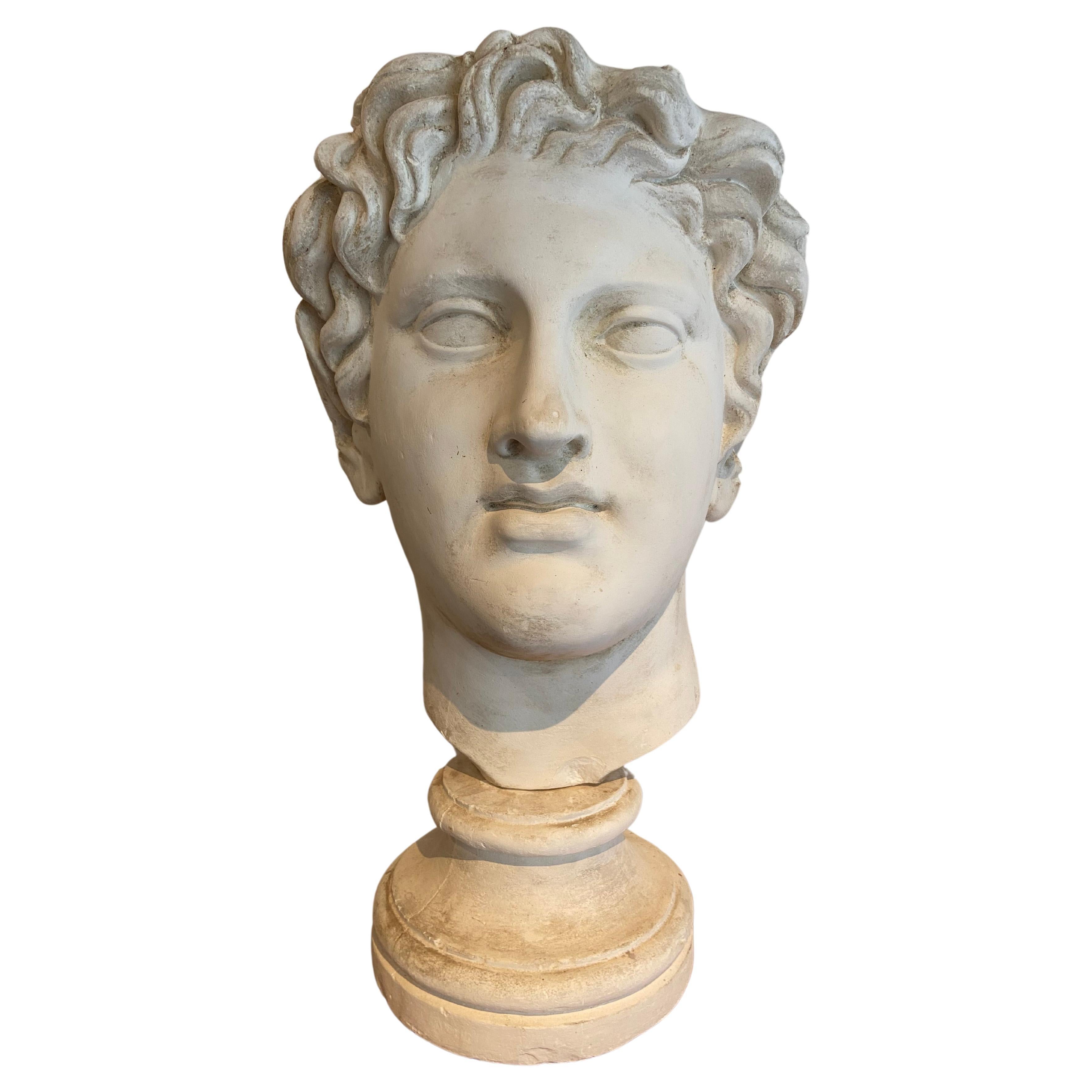 Stucco head of a roman figure For Sale