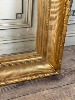 Stuccoed and gilded wooden frame in Louis XVI style, circa 1900