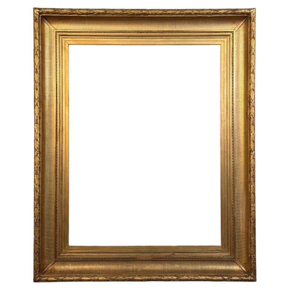 Stuccoed and gilded wooden frame in Louis XVI style, circa 1900 For Sale