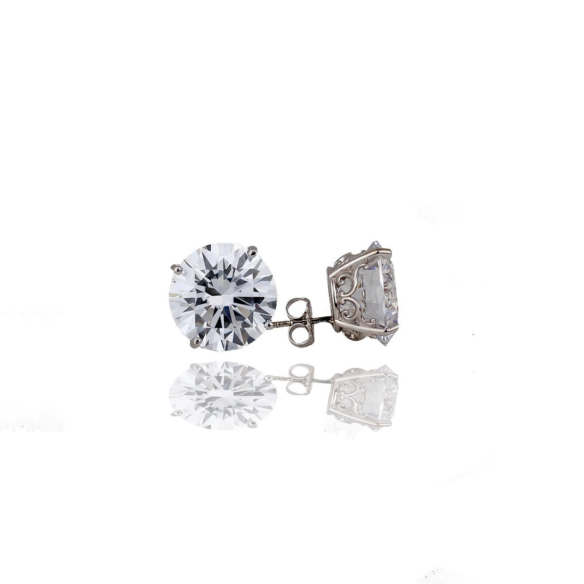 Each stud is a beautiful set 5 Carat. The total weight of the earrings are 10 TCW- 11 mm 14 Karat White Gold 
Custom designed, earring studs measuring 11 millimeters each. Total weight of both stones is 10 carats. 
Center stone is a high quality
