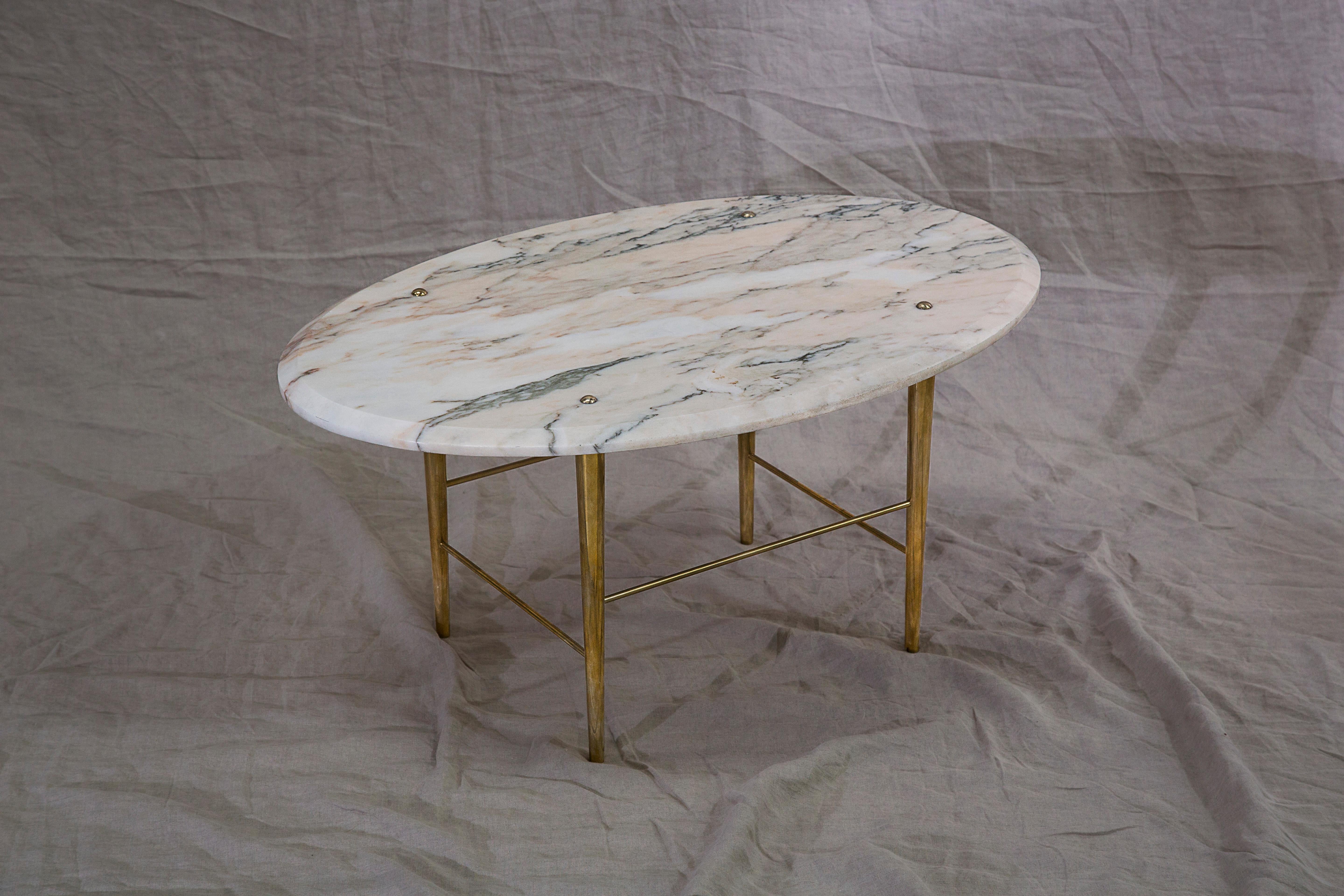 A coffee table in Portuguese marble and polished brass. Handcrafted to order in Northern England.

Measures: 1200 mm (L) x 760 mm (W) x 400 mm (H)

Bespoke sizes and finishes available.