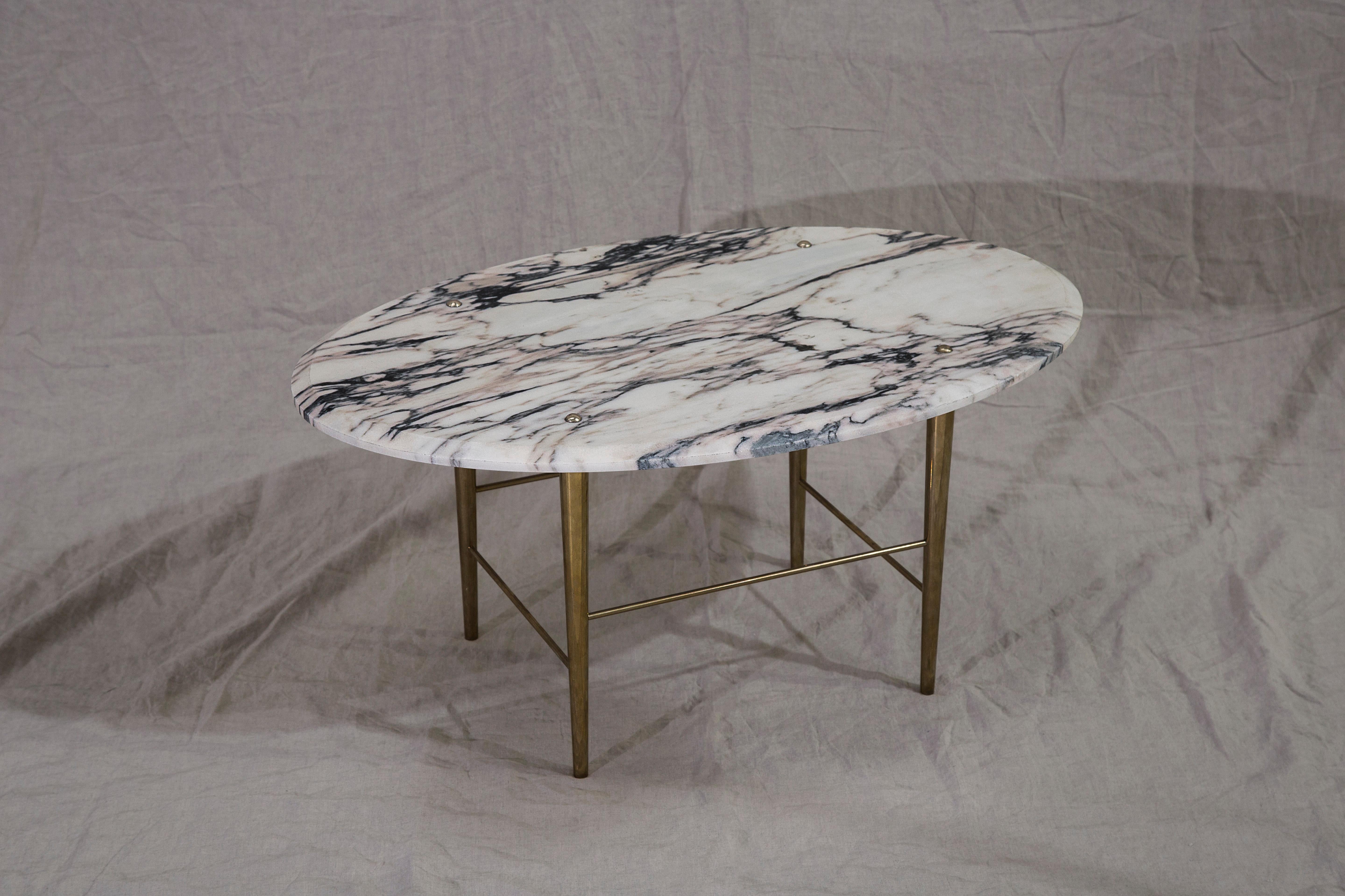A coffee table in Portuguese marble and polished brass. handcrafted to order in Northern England.

Measures: 800 mm (L) x 500 mm (W) x 400 mm (H)

Bespoke sizes and finishes available.