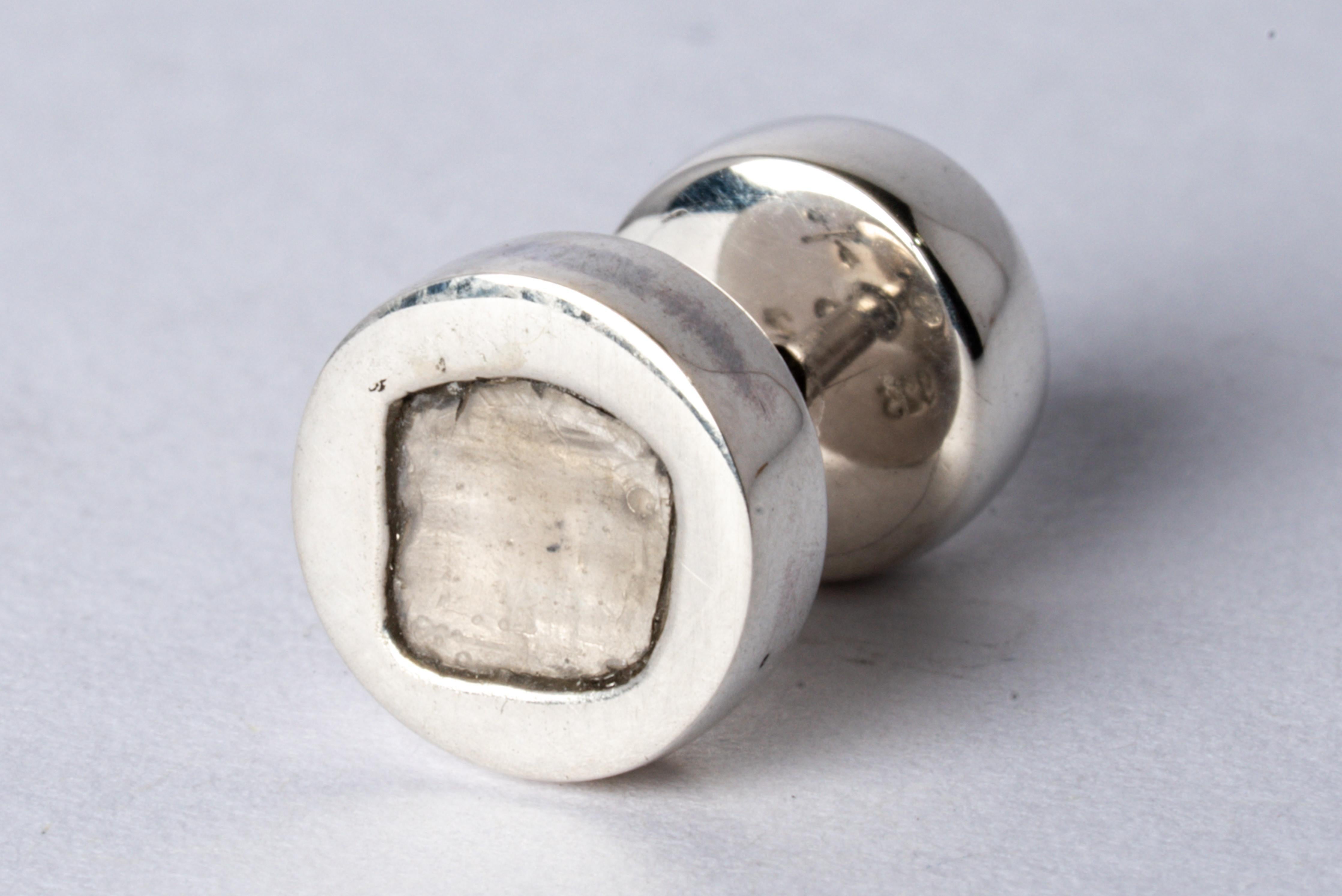 Stud earring in sterling silver and slabs of rough diamond. These slabs are removed from a larger chunk of diamond. This item is made with a naturally occurring element and will vary from the photograph you see. Each stone fragment and shape are