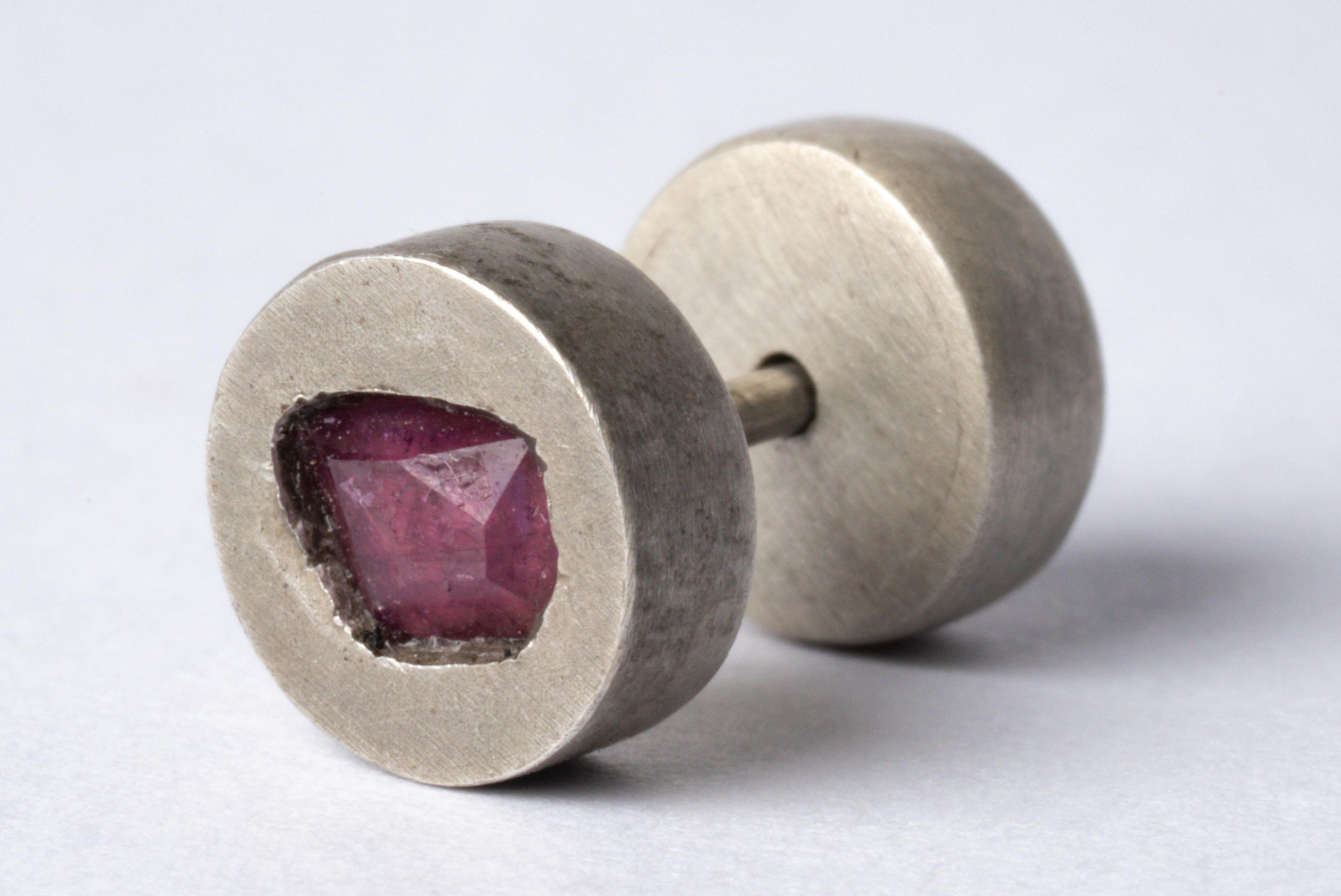 Stud earring in sterling silver and a slab of rough ruby (faceted). This item is made with a naturally occurring element and will vary from the photograph you see. Each piece is unique and this is what makes it special. 
Sold as a single piece.