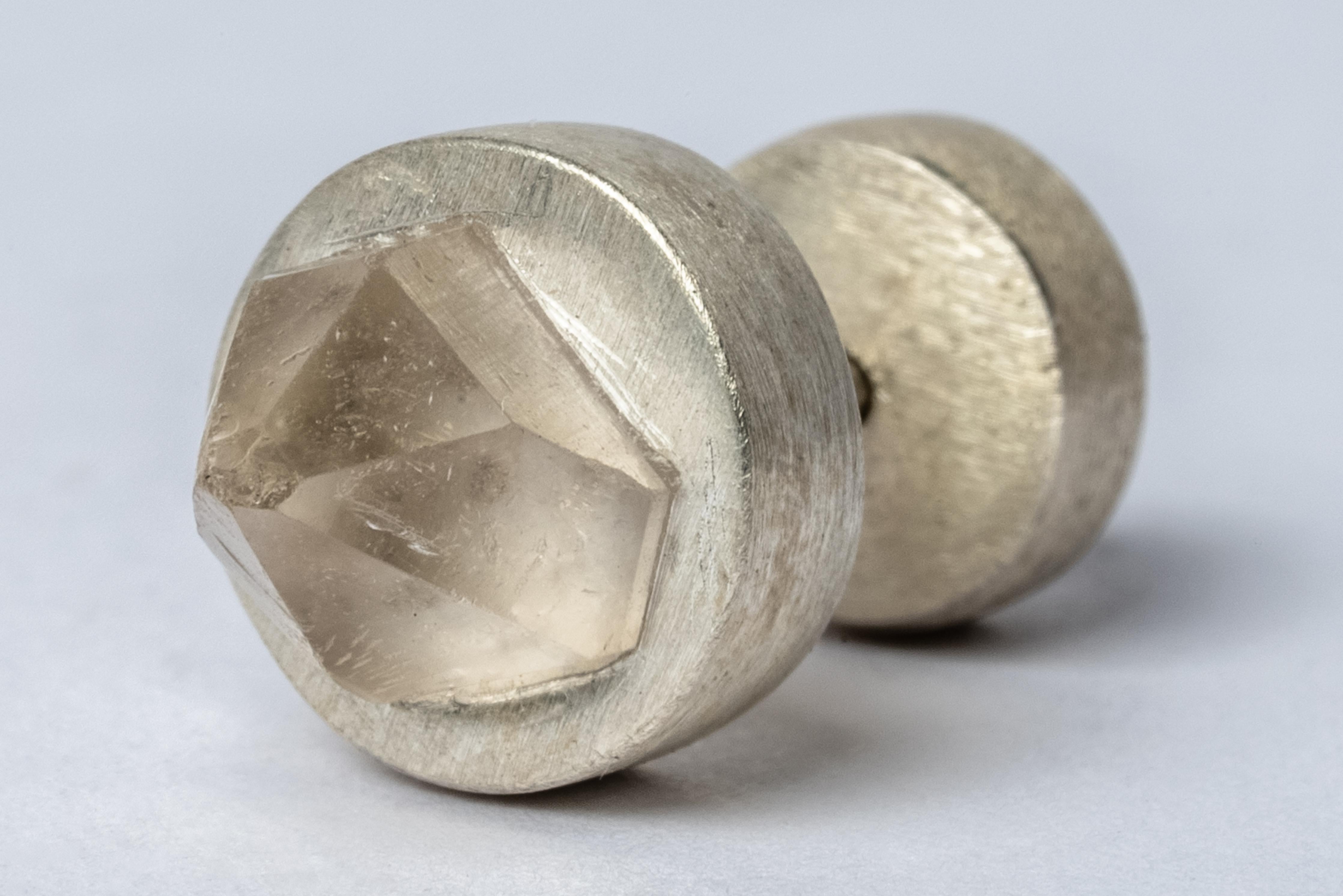 Stud earring in matte sterling silver and a rough of herkimer diamond. We use facet-grade rough gemstones which means that the traditional intention of this rough material is cut faceted stones. This assures the highest quality material while
