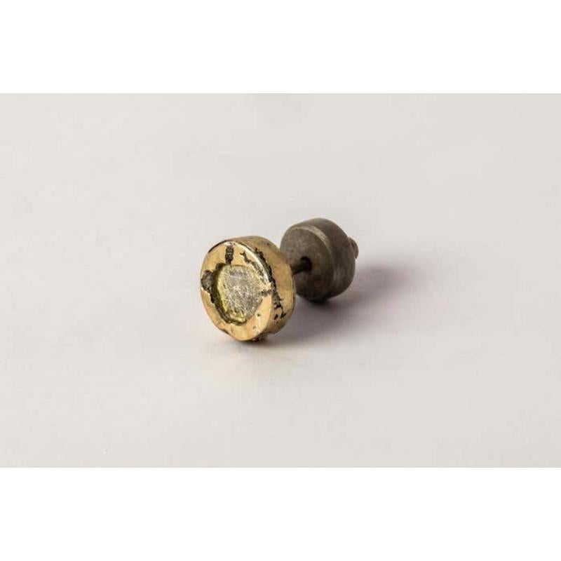 Stud earring in sterling silver, 18k solid yellow gold layer fused on the surface and slabs of rough diamond. These slabs are removed from a larger chunk of diamond. This item is made with a naturally occurring element and will vary from the