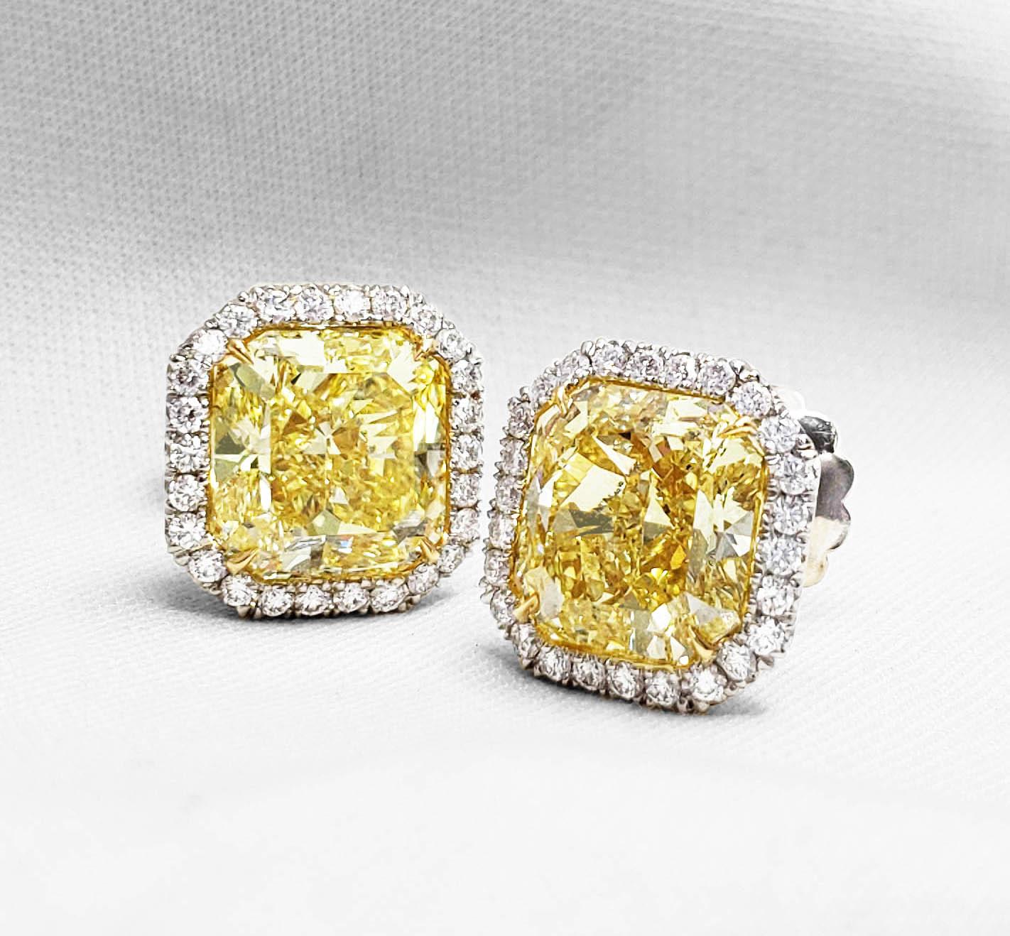 Natural GIA-certified fancy intense yellow radiant-cut diamond earrings, featuring 4.79 and 4.94 carats respectively, on a platinum and 18k yellow gold setting. Classic radiant-cut fancy intense yellow diamond earrings with VS2 clarity, with 52