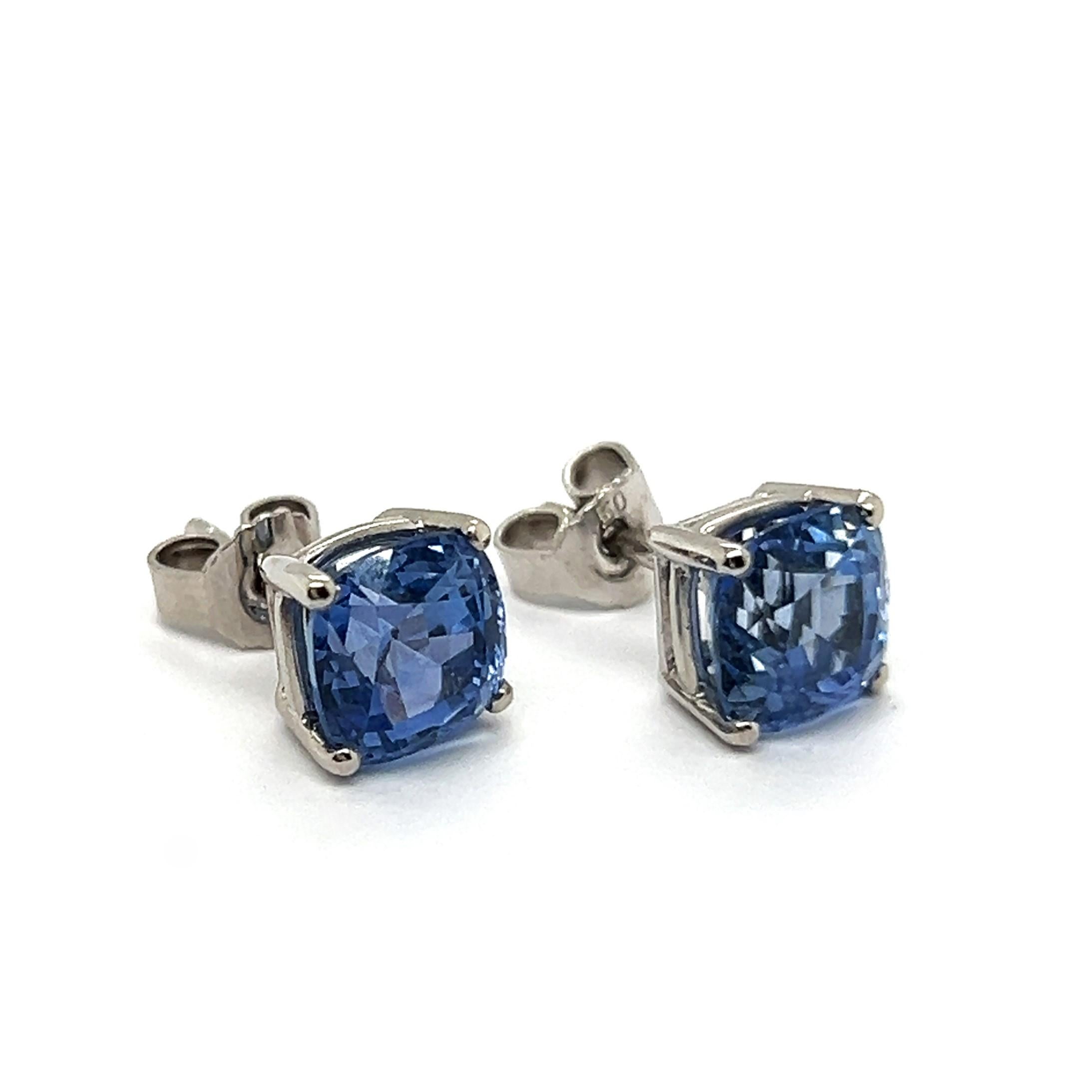 Discover the elegance of simplicity with our refined stud earrings, crafted from 18 Karat white gold and adorned with two stunning blue sapphires. Each cushion-cut gem—2.63 and 2.72 carats—highlights its natural, unenhanced beauty, free from any