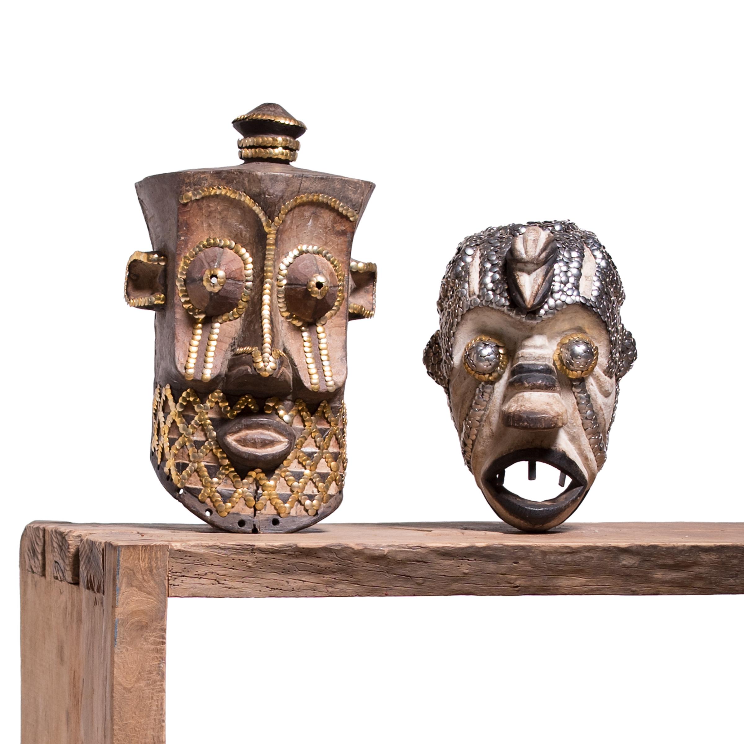 In an exclusive collaboration with Pagoda Red, Chicago artist the bms. adds a contemporary twist to our collection of one-of-a-kind African art objects. Embellishing with silver and gold thumbtacks, the bms. accentuates the sculptural form of this