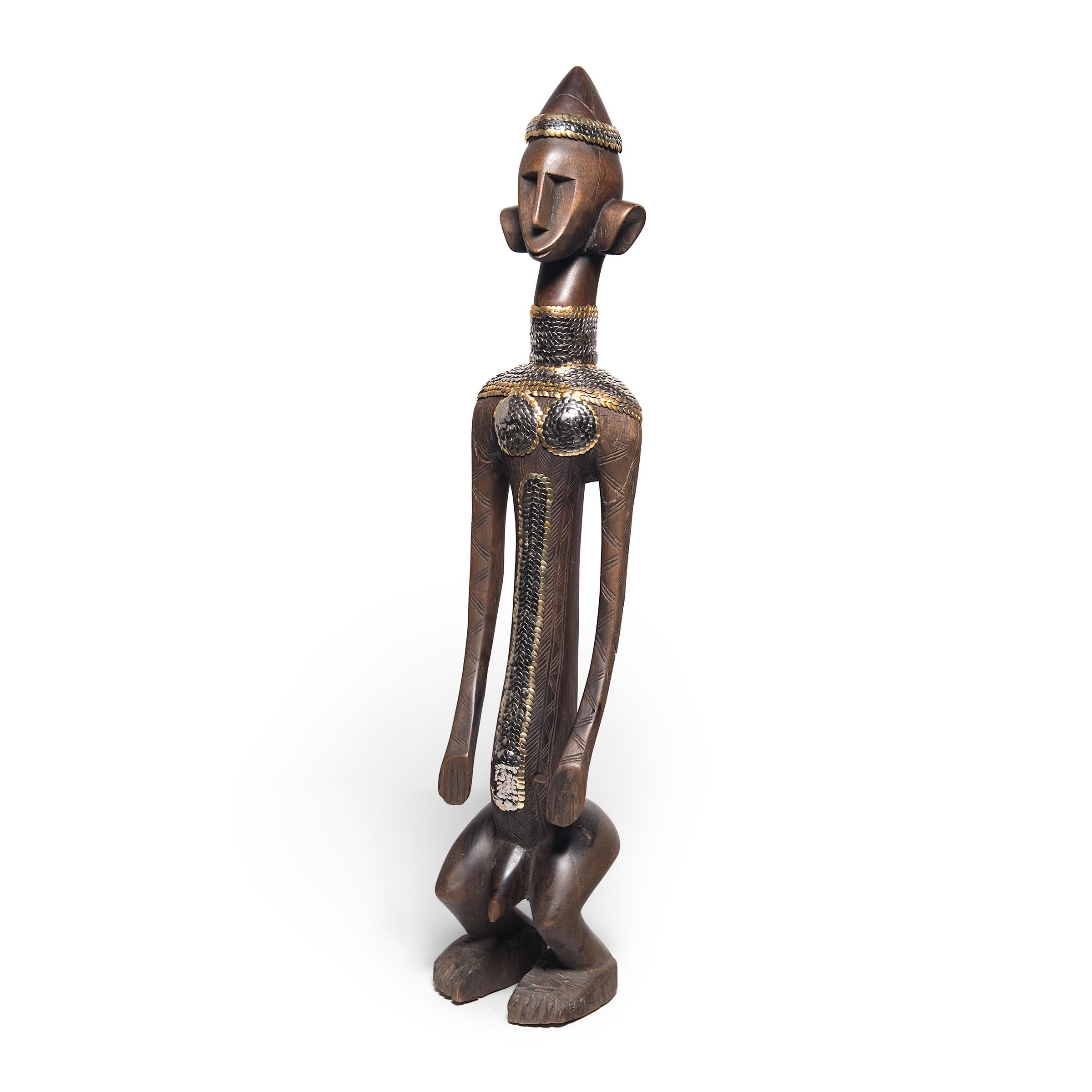 In an exclusive collaboration with pagoda red, Chicago artist the bms. adds a contemporary twist to our collection of one-of-a-kind African art objects. Guided by its geometric line work, the bms. uses silver and gold thumbtacks to accentuate the