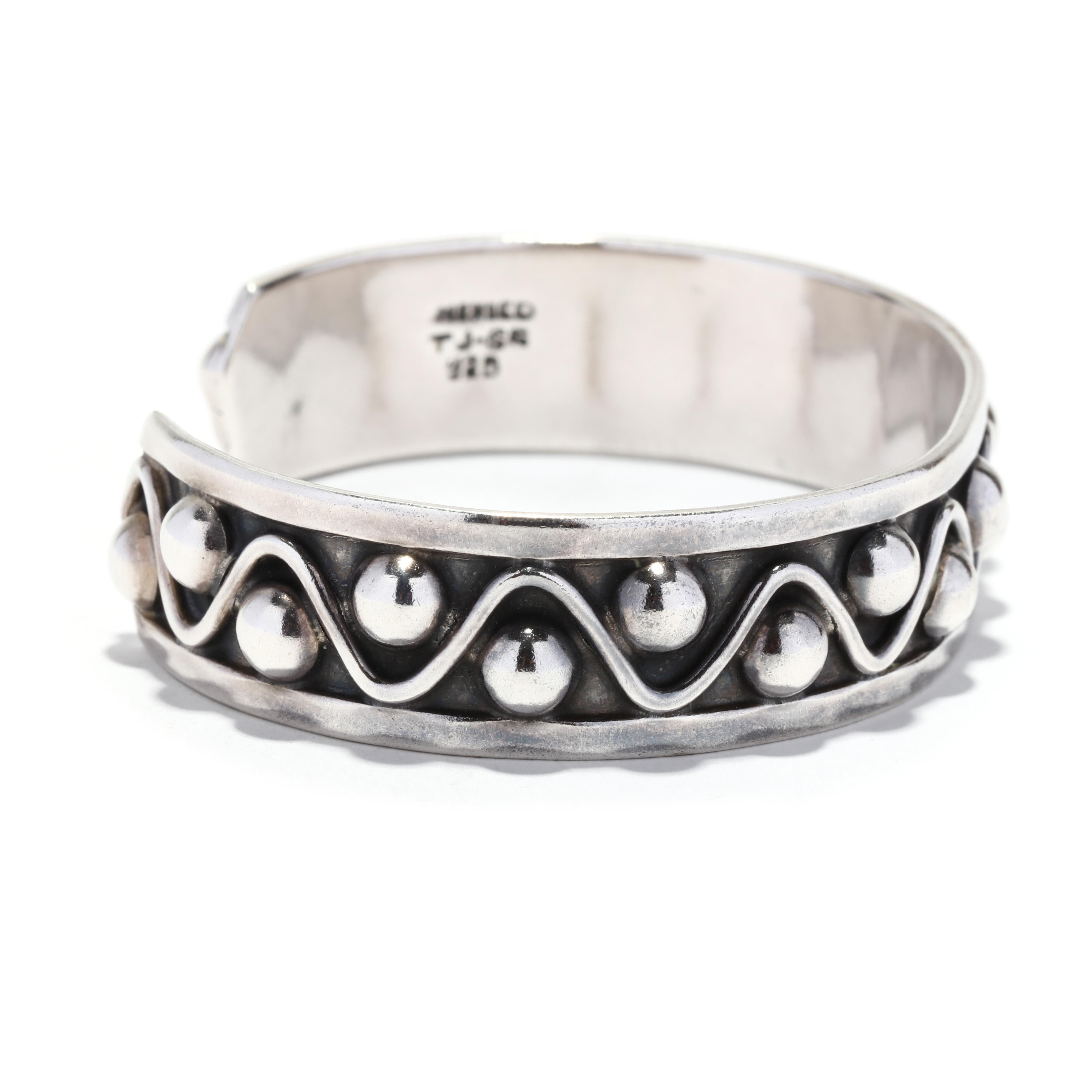 This stunning sterling silver Mexican cuff bracelet is a unique piece that will make a beautiful addition to any jewelry collection. Measuring 6 1/2 inches in length, this studded cuff bracelet is perfect for adding a touch of style and