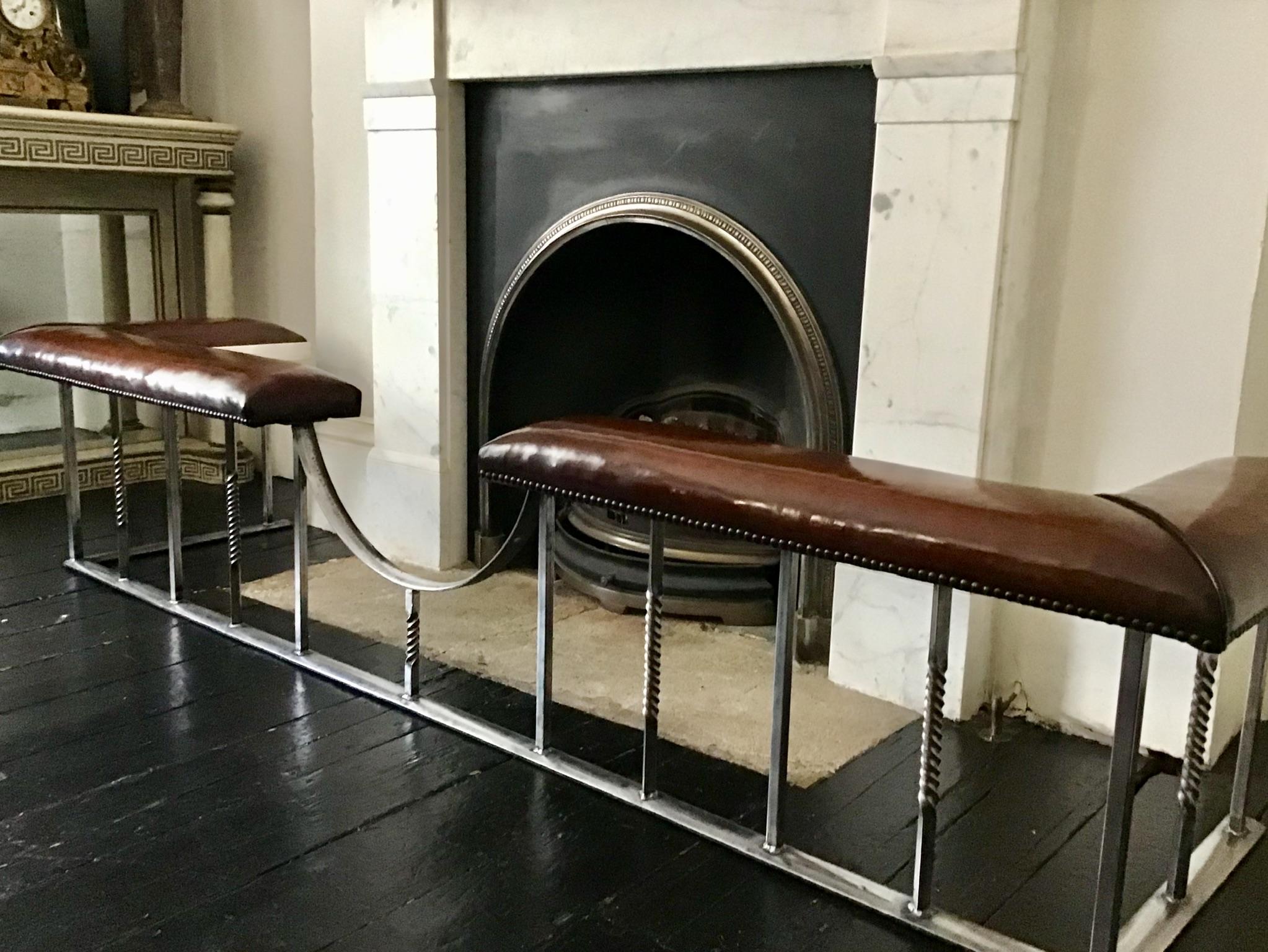 Early 20th century polished wrought iron with alternating spiral twist balustrade supporting twin studded and hand finished leaf tan brown padded leather seats and with dipped bow centre.
 