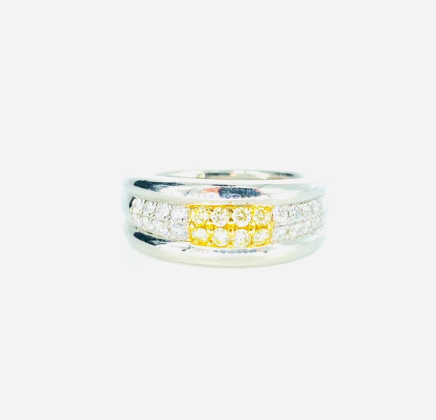 Designer 0.46 Carat Fancy Yellow & White Diamonds Platinum/18k Yellow Gold Band Ring. The ring weight 15.4 grams and is a size 6. The ring measures 8.22mm in height and is marked STUDIO 18k platinum 900