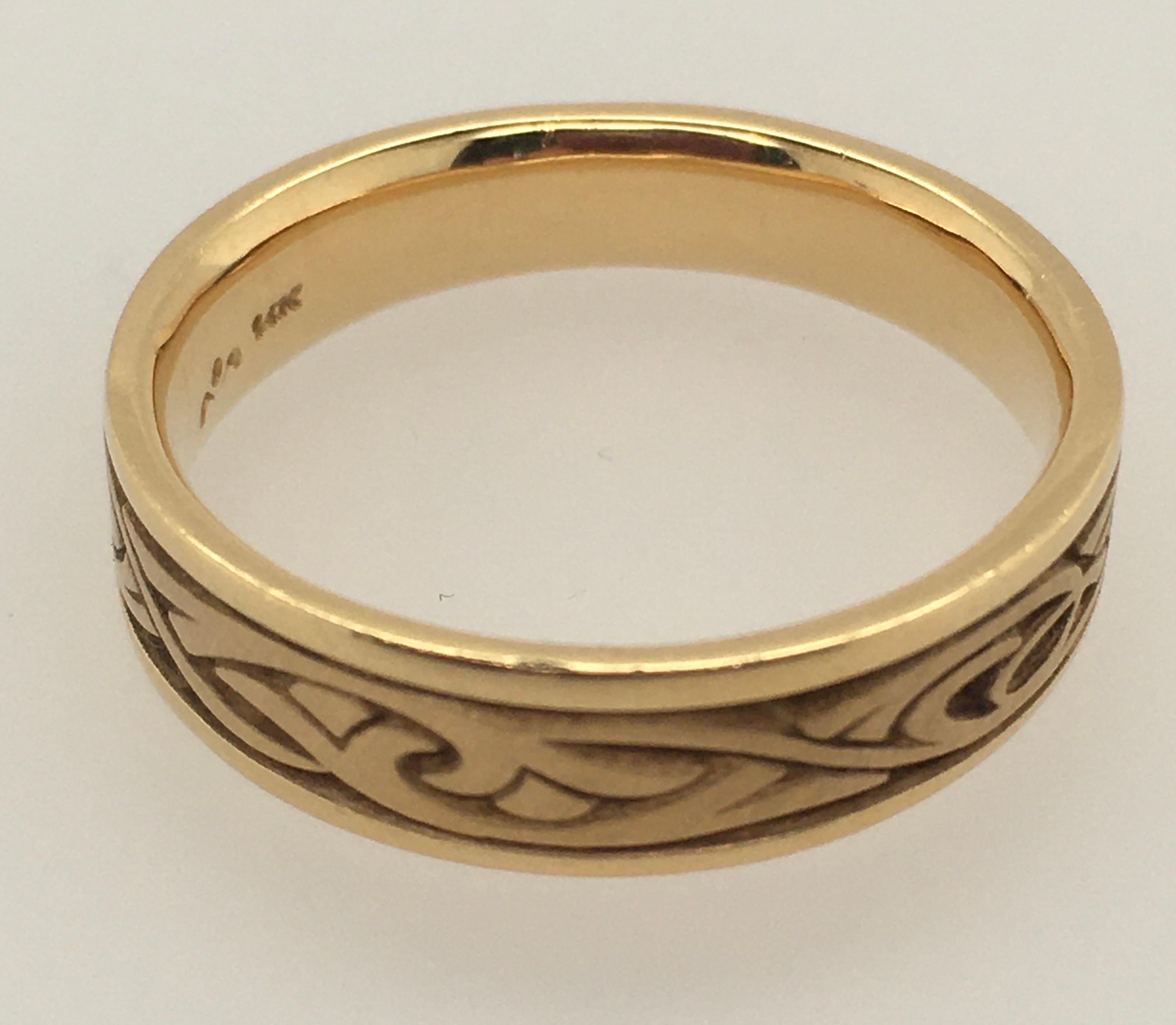 A dramatic Studio 311 14K yellow gold Narrow Papyrus Men's band, 6.0 mm at its widest, with flat polished edges to compliment the intricate Papyrus pattern.  Style number is 11281.  The Comfort Fit ring is currently size 10.5; the design allows for