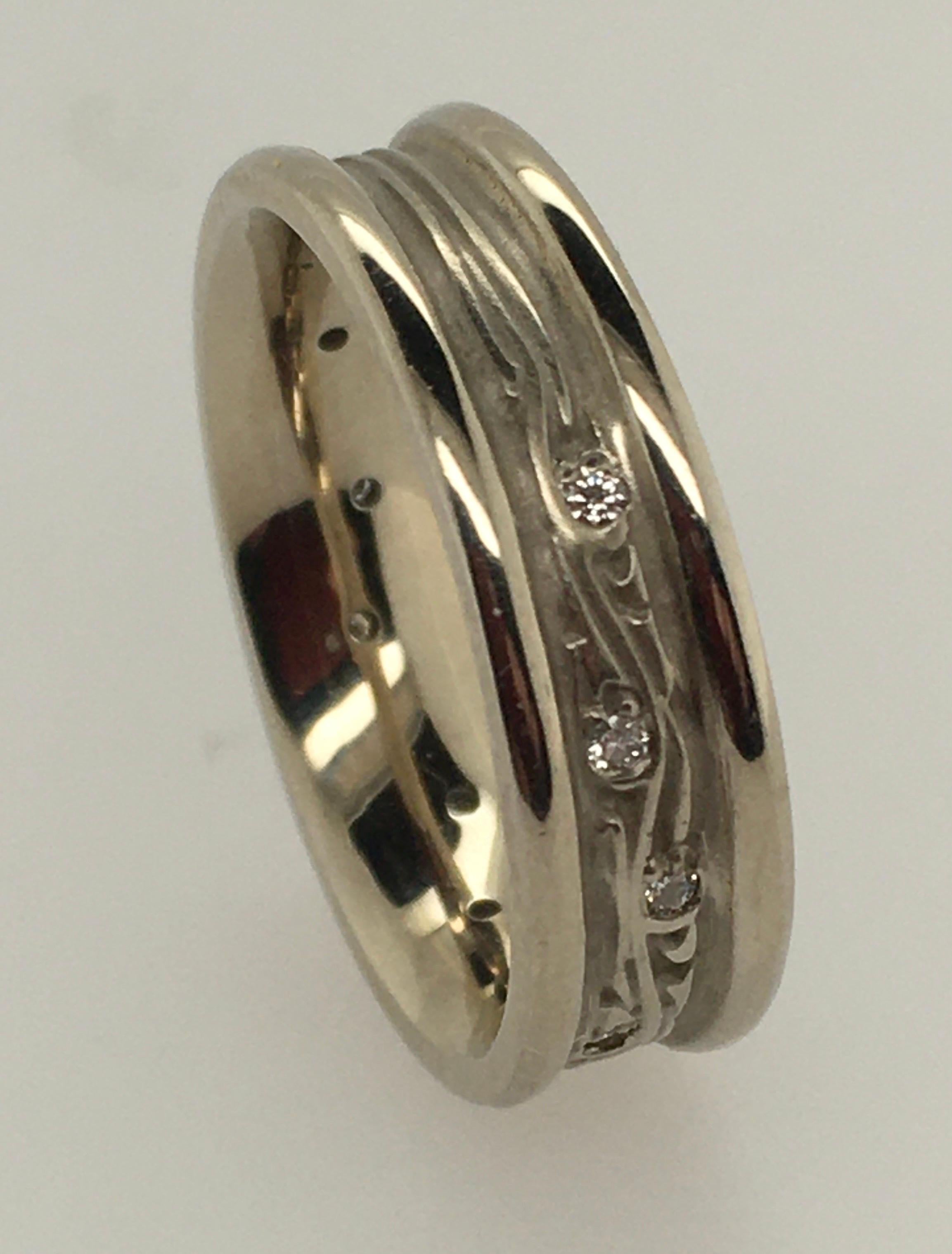 Studio 311 created their Night Sky Collection, inspired by Dutch painter Vincent Van Gogh's 1889 Starry Night landscape.  We offer this classic example of that unique, refined design that typifies Studio 311.  This women's Narrow Starry Night 14k