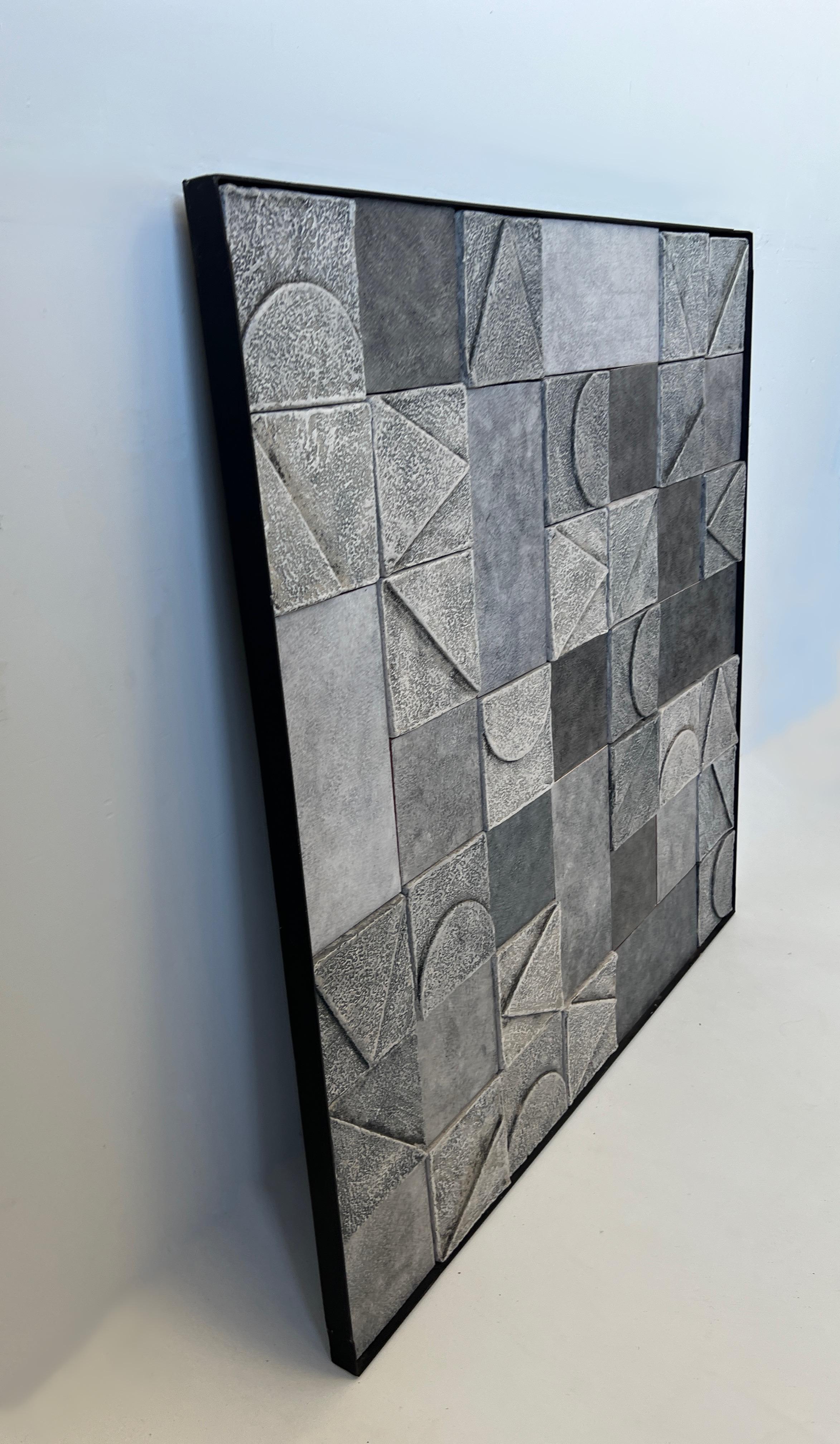 Beautiful studio ceramic glazed abstract mural. 
The glaze is gray tones colors. 
Black lacquered steel frame. 
Measurements: 39.63” wide 39.63” high, 1.25” deep.