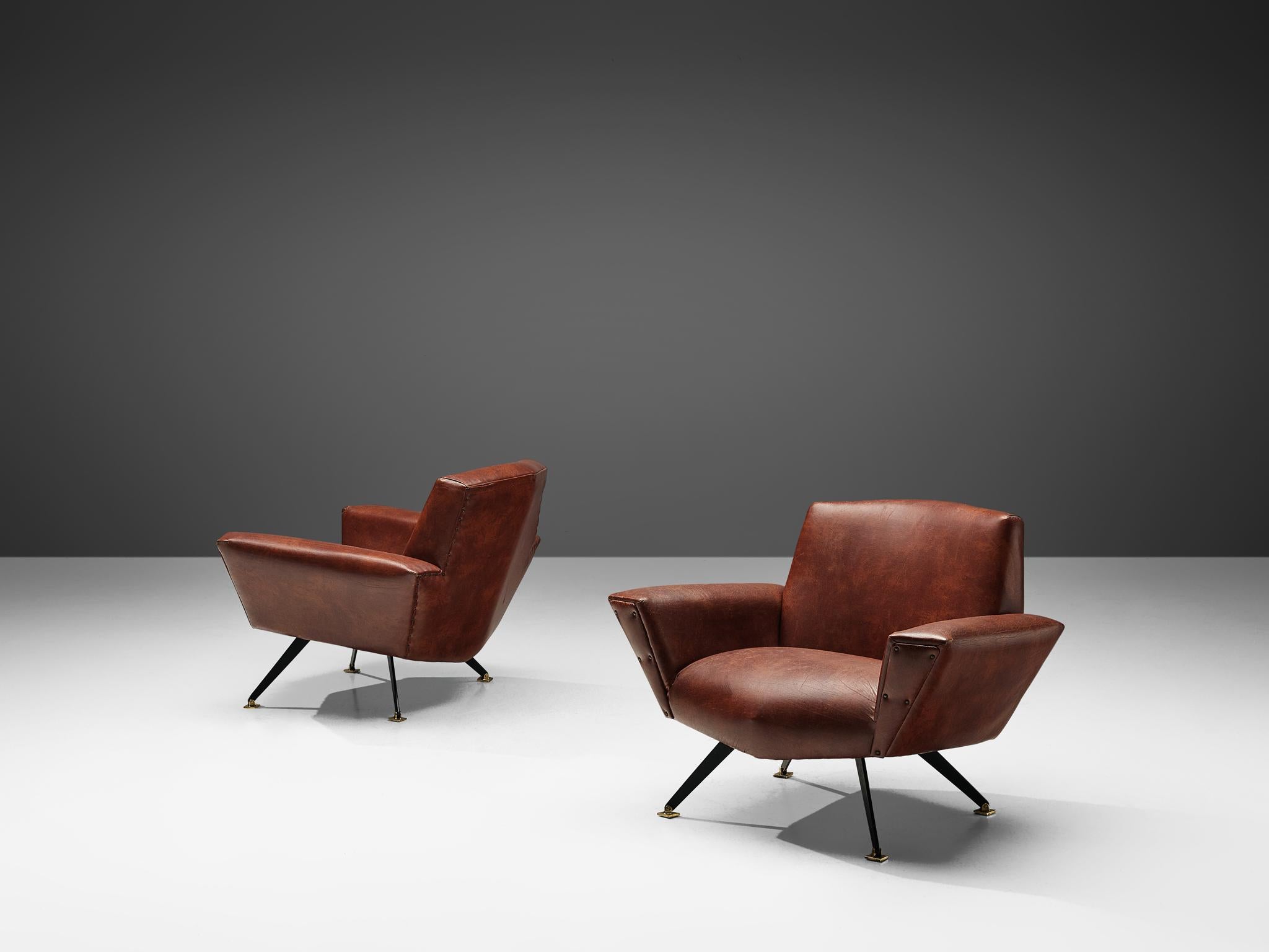 Studio APA for Lenzi, pair of club chairs model 'M538', leatherette, metal, brass, Italy, 1960s

This dynamic pair of armchairs originates from Italy and features a well-proportioned construction of sharp angles and straight lines. This piece of