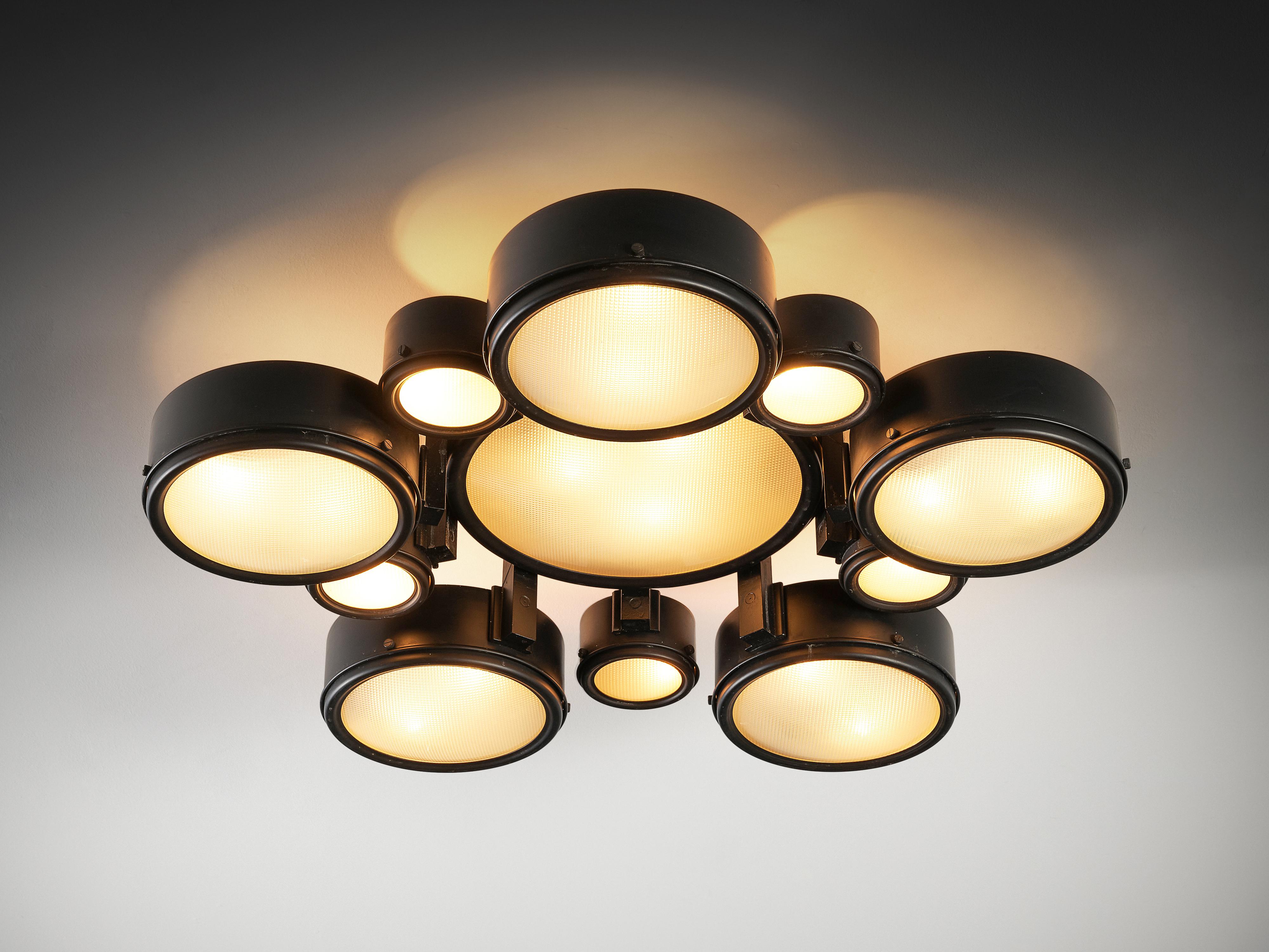 Studio B.B.P.R. for Arteluce, ceiling light, model ‘2045/p’, lacquered aluminum, acid-etched prismatic glass, Italy, 1962

This playful ceiling light is designed by Studio B.B.P.R. for the Italian lighting company Arteluce. A composition of