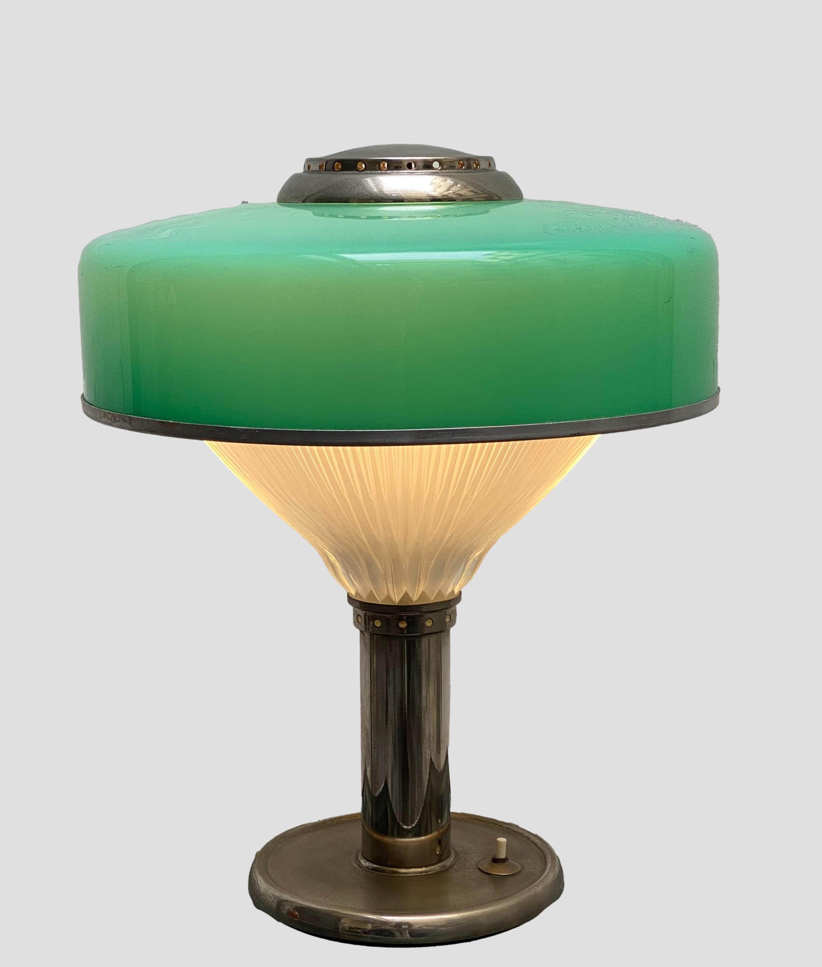 When the light is switched on, it produces a special atmosphere, from the double glass diffuser, top and bottomAn iconic and truly unique vintage table lamp.
This table lamp was designed by the renowned Italian architects' studio in the 1960s and