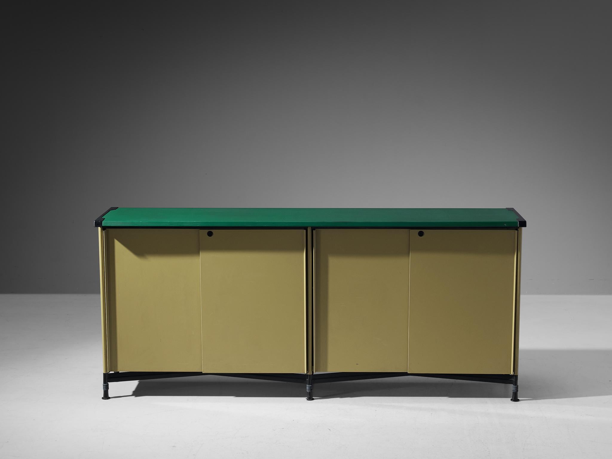 Studio BBPR for Olivetti, 'Spazio' sideboard, steel, vinyl, plastic, Italy, ca. 1960 

This free-standing ‘Spazio’ sideboard features two sliding doors with a lock. Due to the sloping edges of the top, a green line accentuates the front and back.