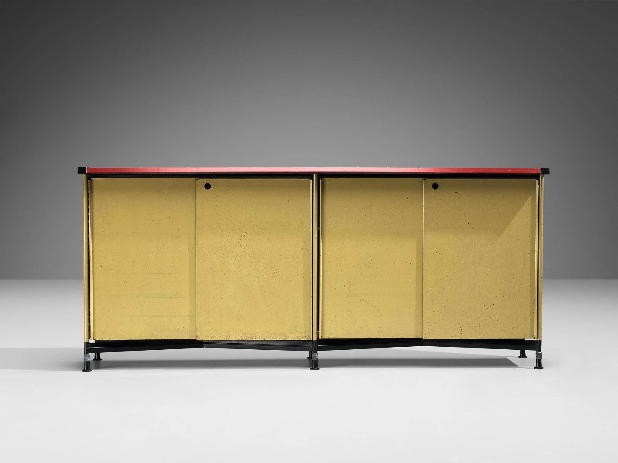 Studio BBPR for Olivetti, 'Spazio' sideboard, steel, vinyl, plastic, Italy, ca. 1960 

This free-standing ‘Spazio’ sideboard features two sliding doors with a lock. Due to the sloping edges of the top, a green line accentuates the front and back.