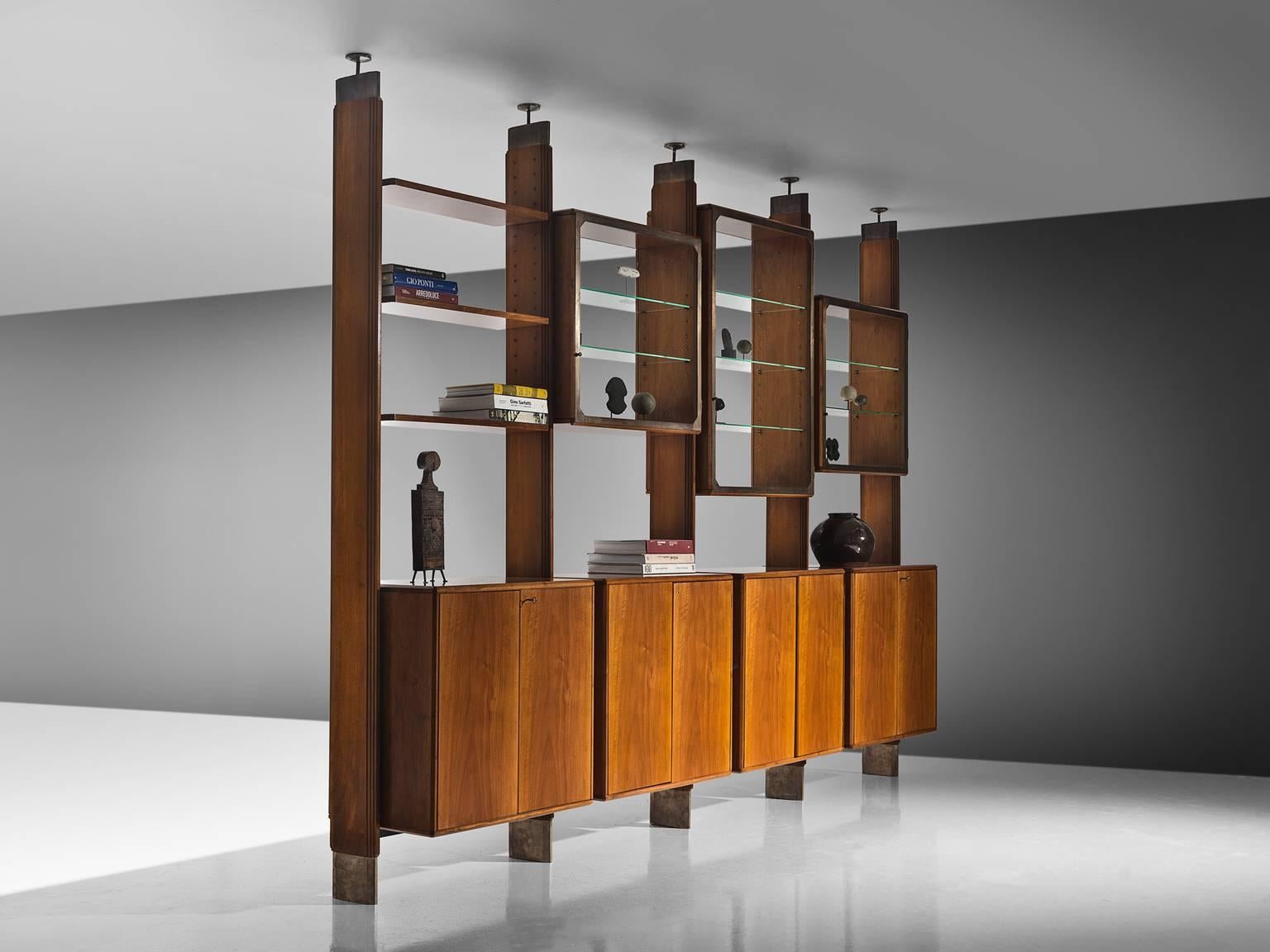 Studio BBPR for Pierino Frigerio, wall unit, Italian walnut, Italy, circa 1952.

This cabinet is designed by Studio BBPR and executed by Pierino Frigerio. It is a truly marvellous piece by the architectural collective. The library wall is made for