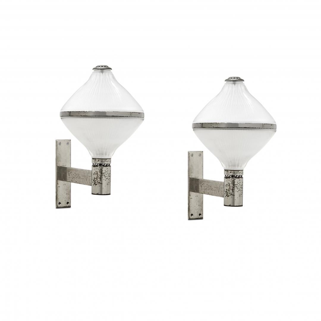 Pair of sconces by Studio BBPR frpm Artemide Italy 1966s .These appliques are historical pieces of Italian Design . The Studio BBPR gruop has been emerging and revolutionary. Their pieces are increasingly rare to find.