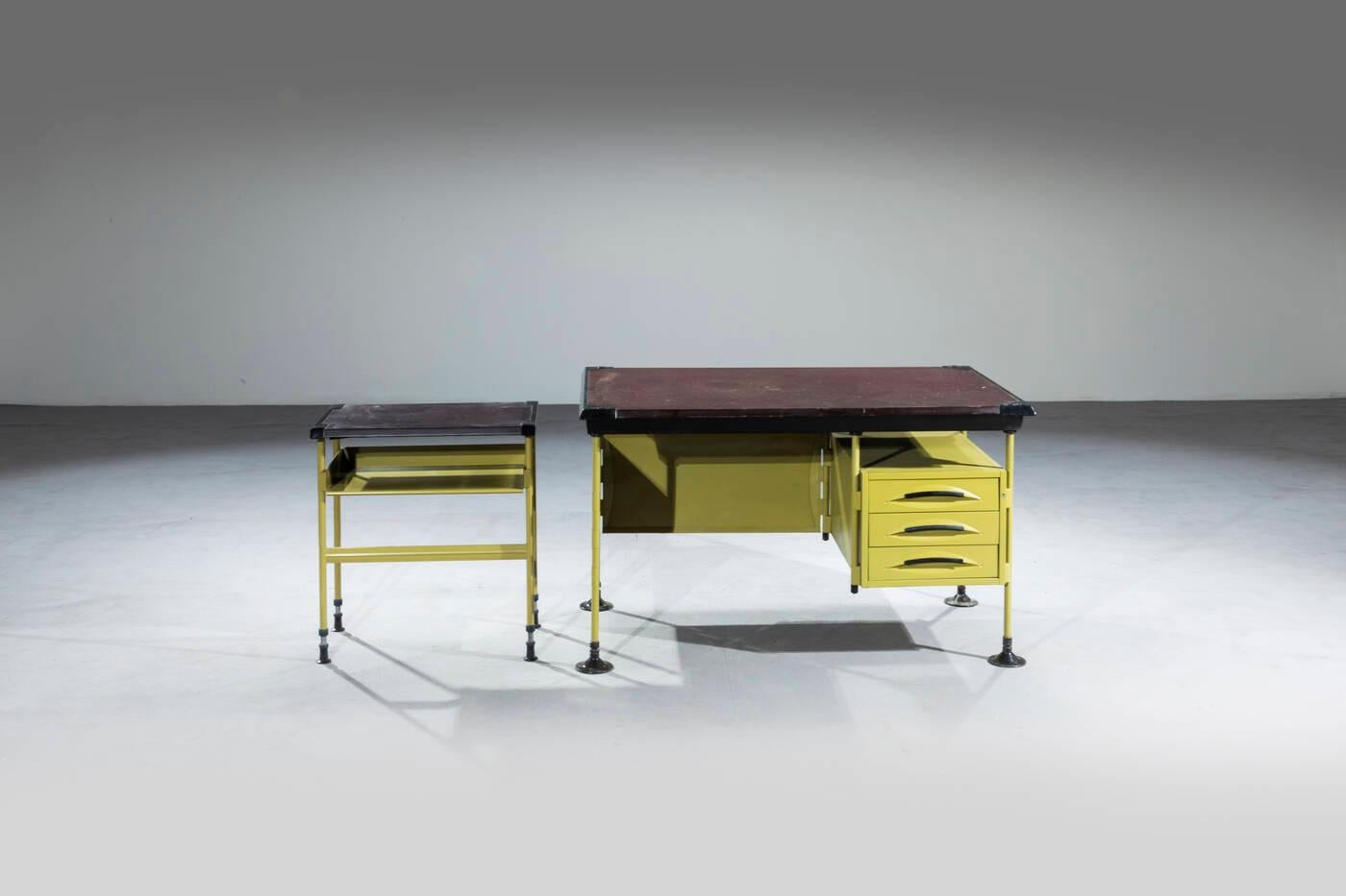 Desk and cabinet mod. Spazio designed by Studio BBPR and produced for Olivetti in the 1960s
Painted metal frame, plastic, vinyl leather desk and cabinet top.

78x130x80.5 cm desk
cm 70x64x44 cabinet

BBPR was the acronym for the group of Italian