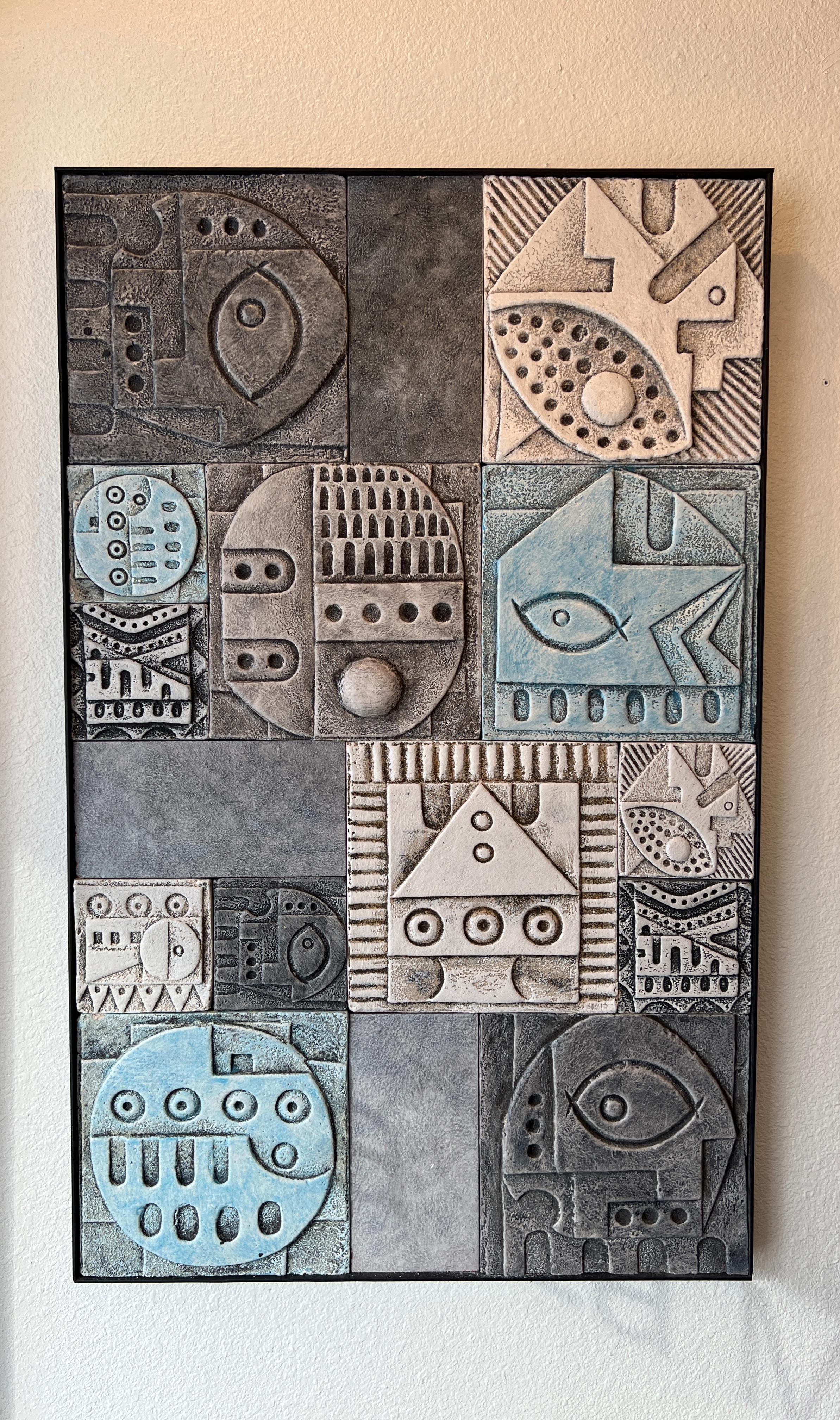 Studio ceramic wall mural with a black lacquer steel frame. 
The glaze colors are lite blue, white and grey tones. 
Measurements: 30” Wide , 47.75” High, 2.75” deep at top, 2” Deep at bottom. 