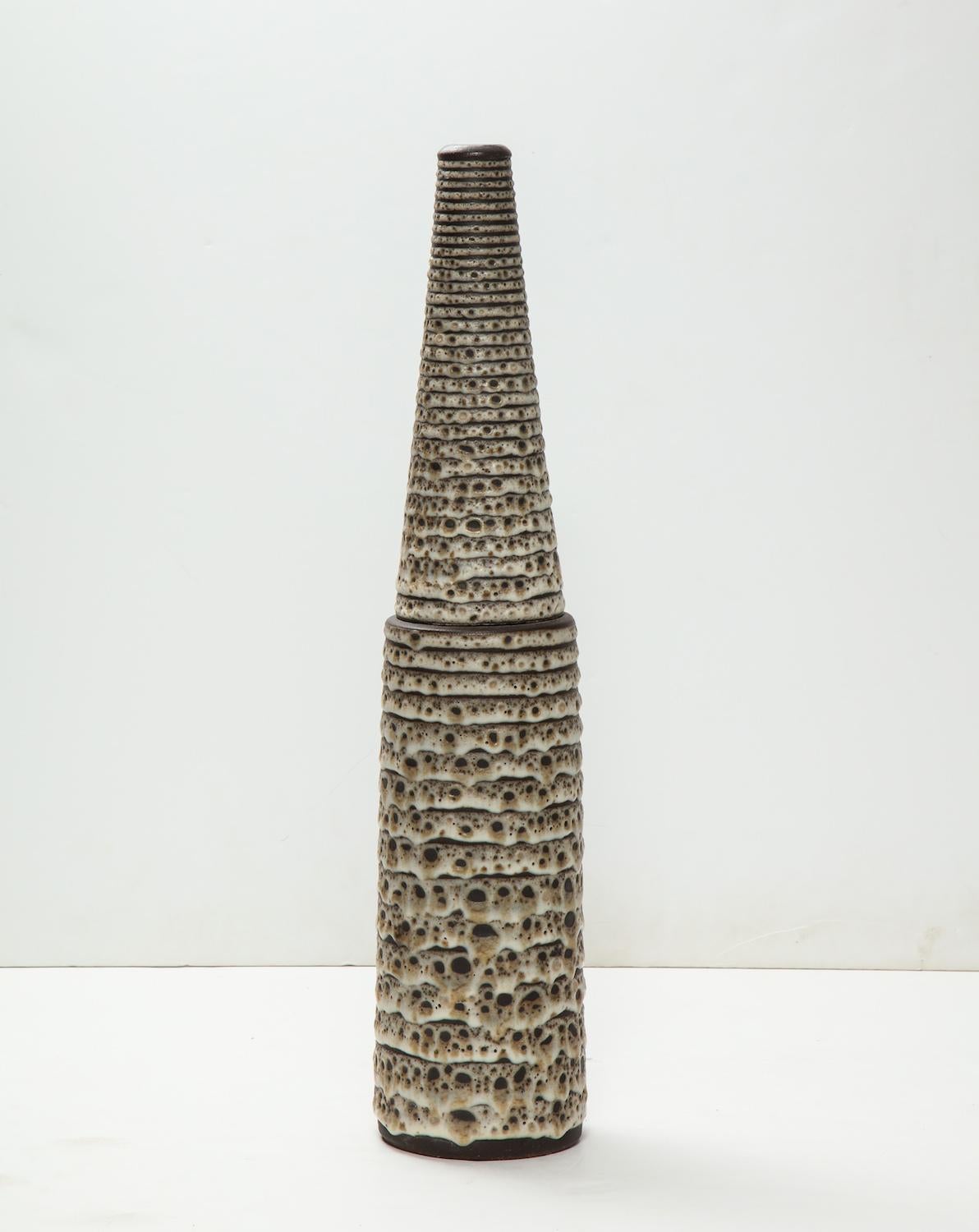 Large-scale cone and cylinder form vessel made on a wheel in two parts. Crater glaze in browns and cream. signed with artists stamp at side bottom.