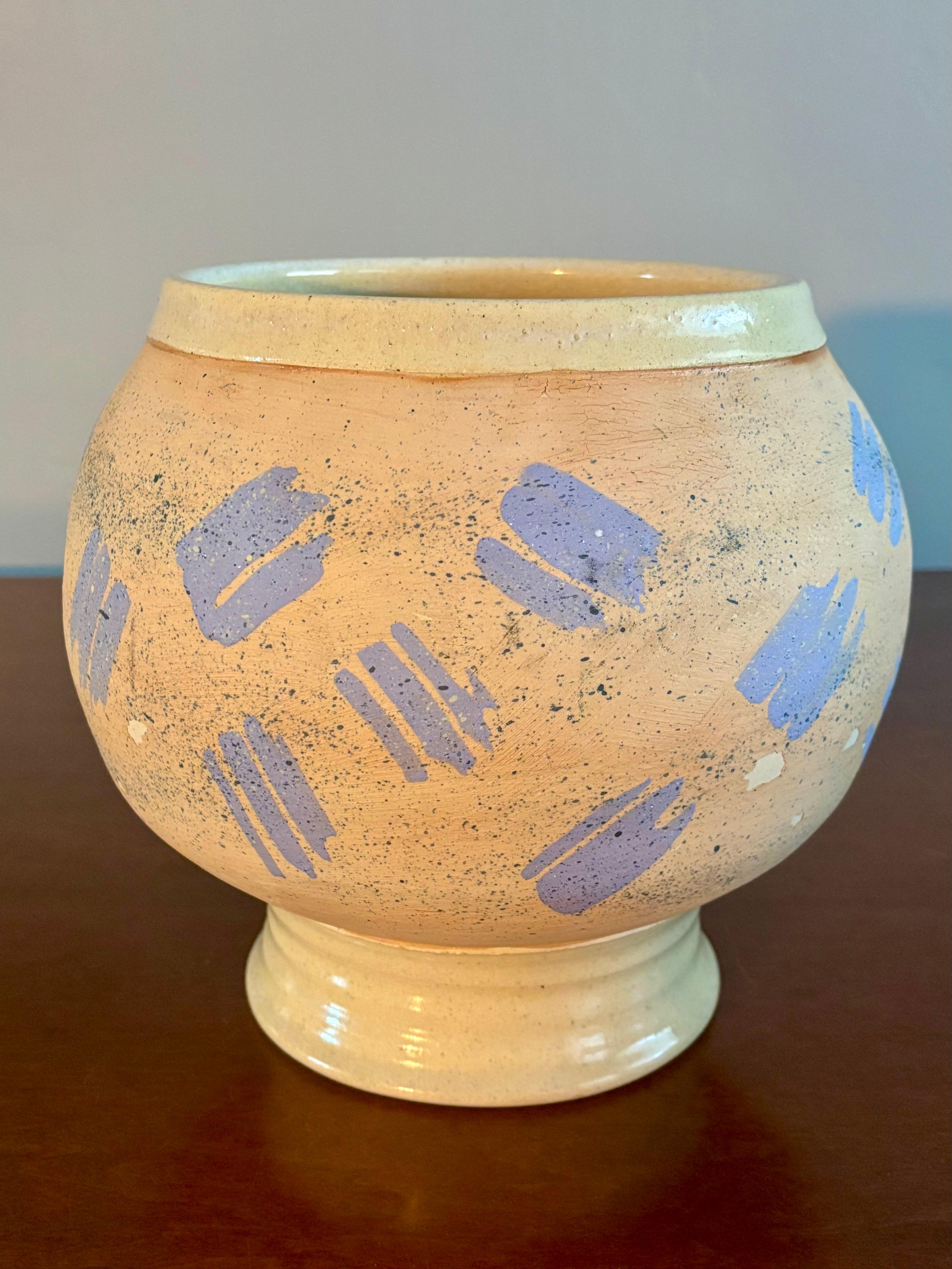 Beautiful and fun post modern vase. American studio made. Signed by artist on bottom. Peach colored with blue accents. 

Some flaking in the glaze.