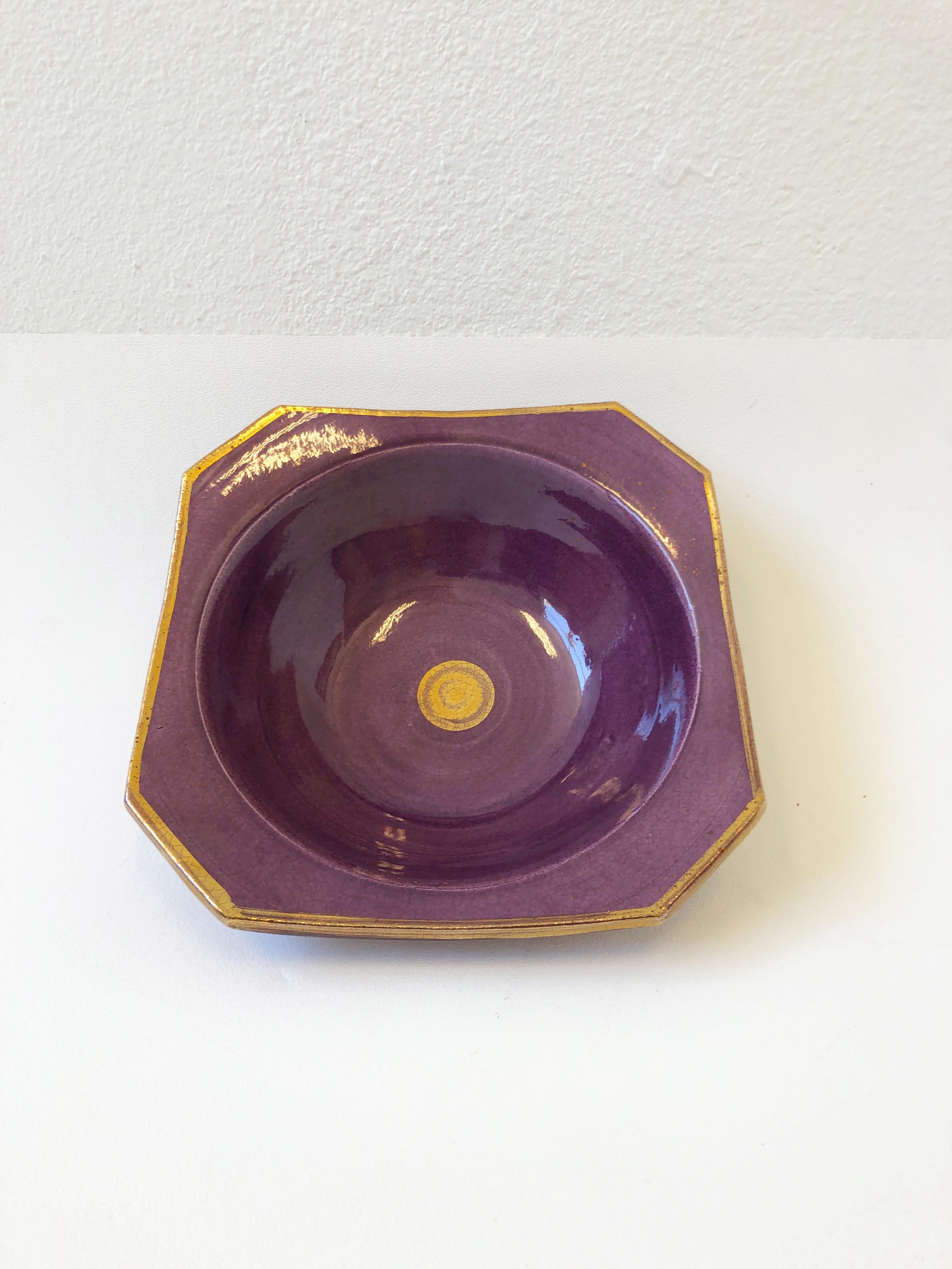 1980’s studio ceramic bowl glazed purple and gold by Gary McCloy for Steve Chase. 
Hand signed and stamped.
Measurements: 10” Wide 10” Deep and 3.25” High.