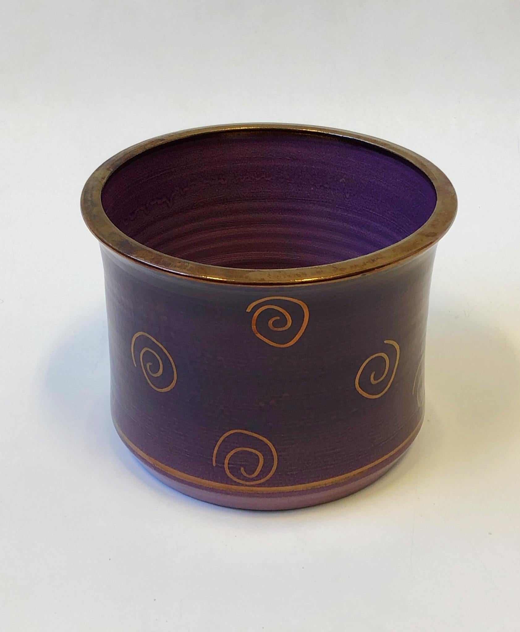 1980’s Studio ceramic planter or cachepot with purple and copper design glazing by Gary McCloy for Steve Chase. Hand signed and marked exclusively for Steve Chase. Price is just for one planter, other one is in a separate listings. 
Measurements: