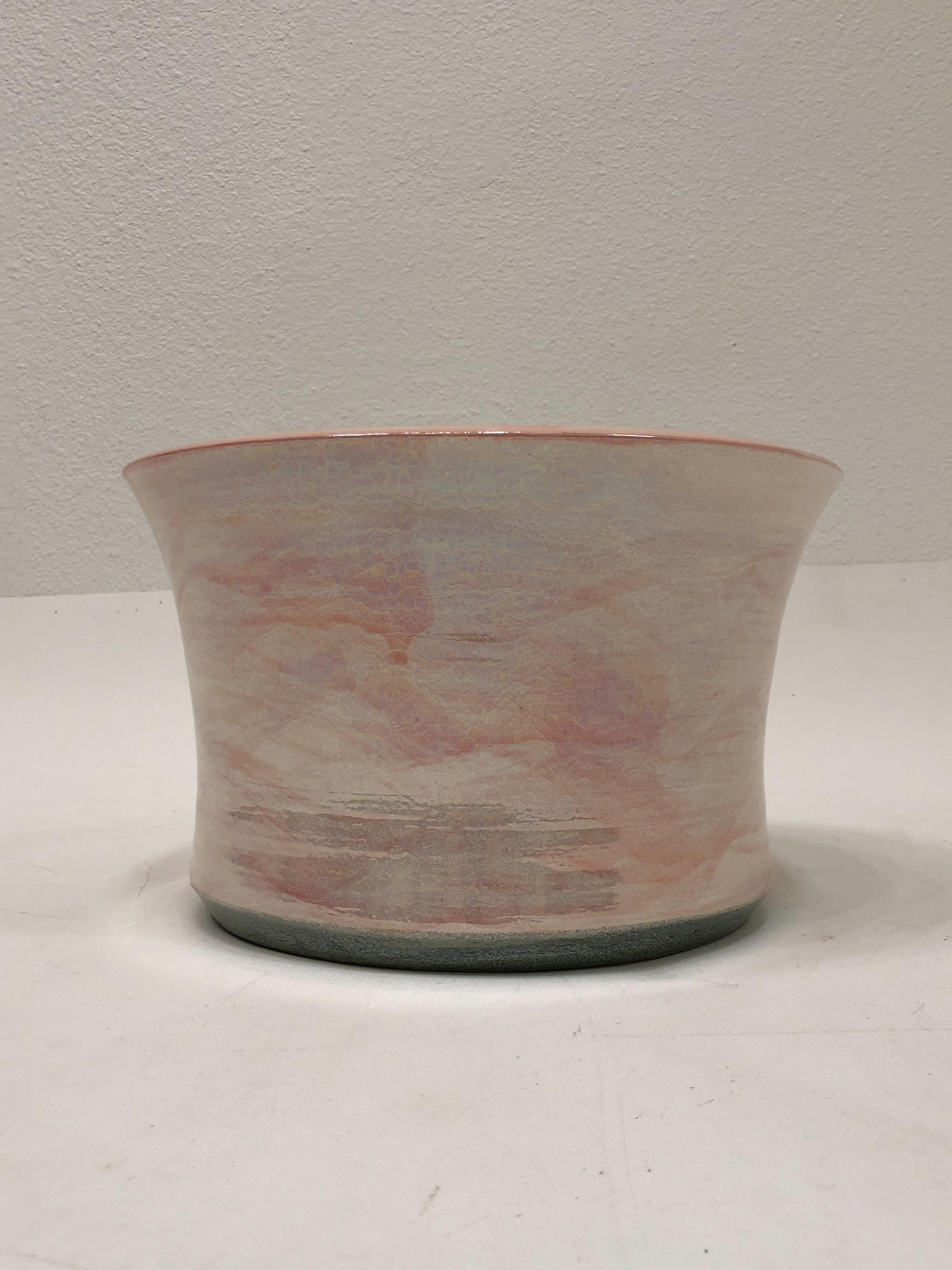 1980’s Studio ceramic cachepot by Gary McCloy for Steve Chase. 
Grate for orchids or indoor plants. 
The finish is a crackle high gloss glaze with brush strokes of pink. 
Hand signed McCoy and Stamped ‘Gary McCoy Exclusively for Steve