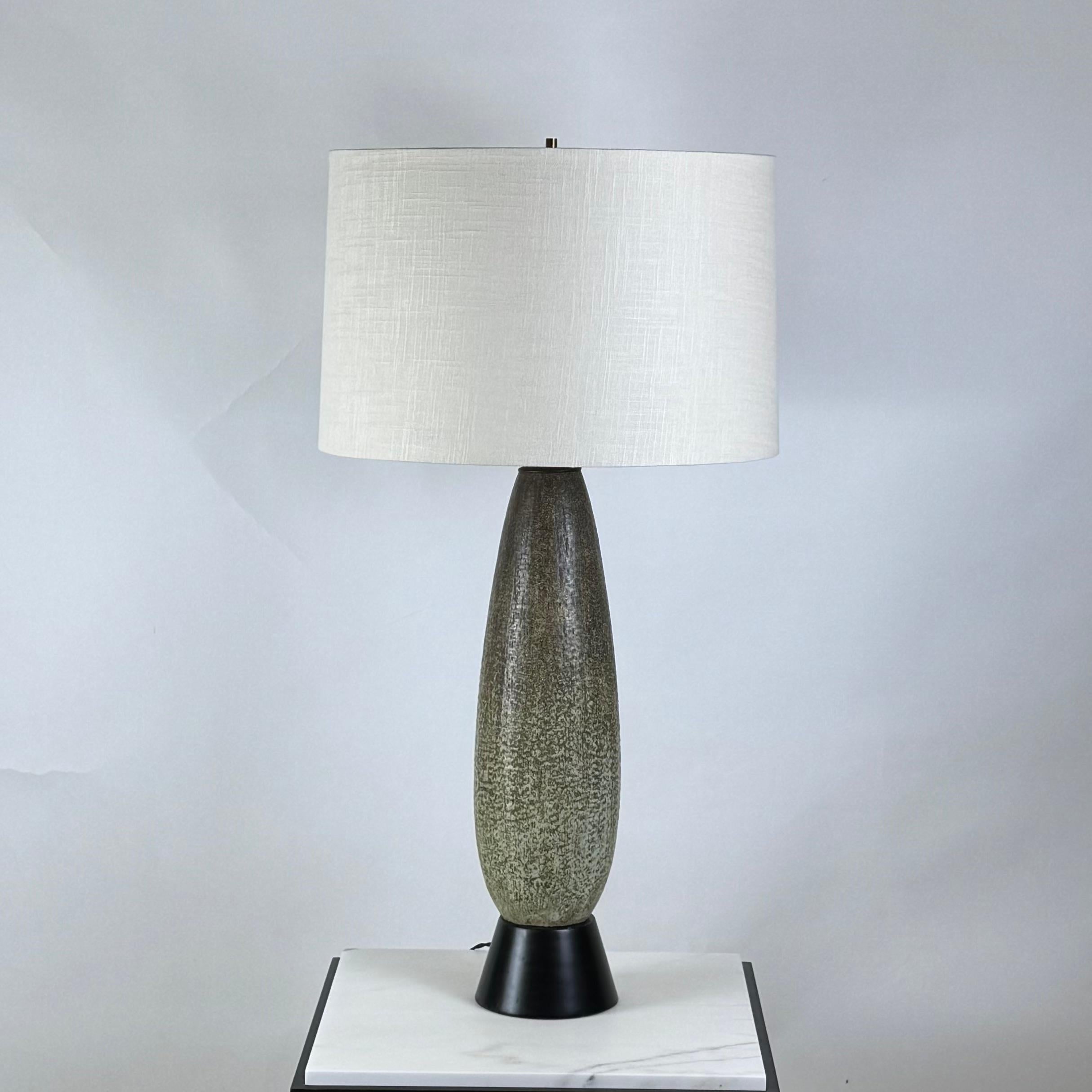 Chic oblong studio ceramic lamp.
Gorgeous textured green glaze.
Rewired with custom linen shade and diffuser.