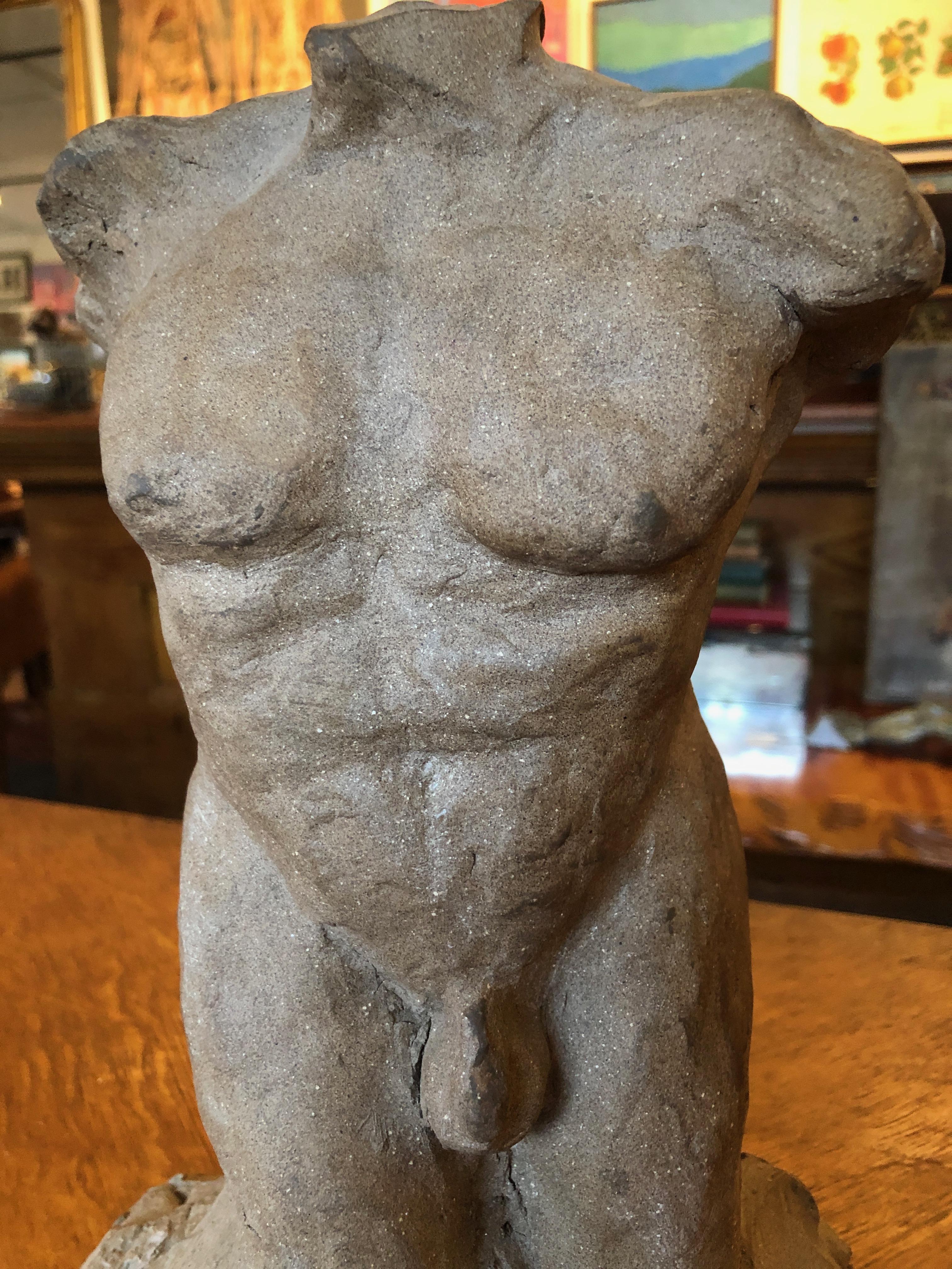 This is a fantastic mid-20th century studio ceramic sculpture of a nude male torso signed 