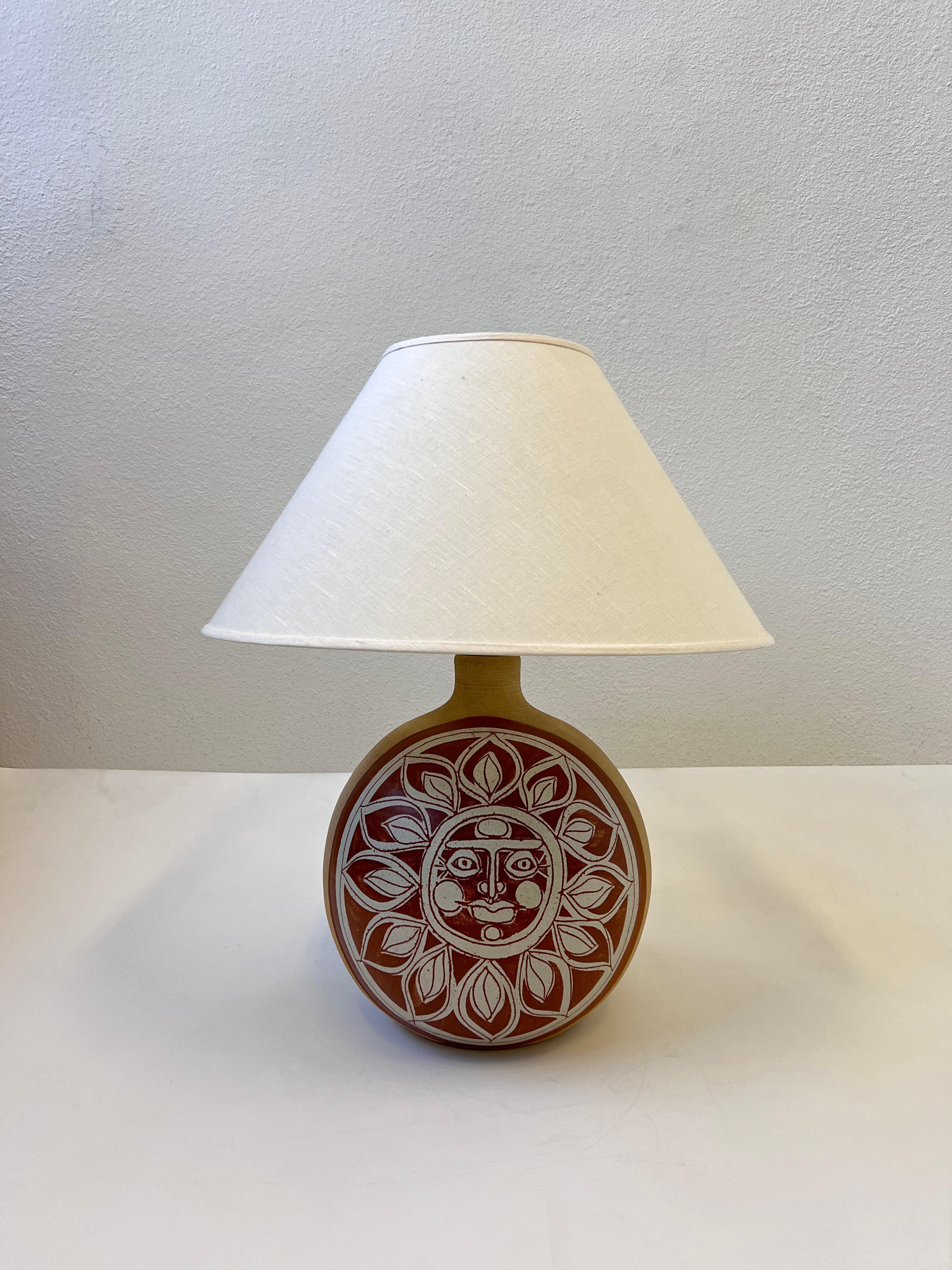 1970’s Studio ceramic sun face table lamp by Oregon ceramicist the Brown brothers Larry and Terry Brown. The hardware is as found condition, we can have it polished if desired. 

Newly rewired and new Shade. 
It takes one 100w max Edison lightbulb.